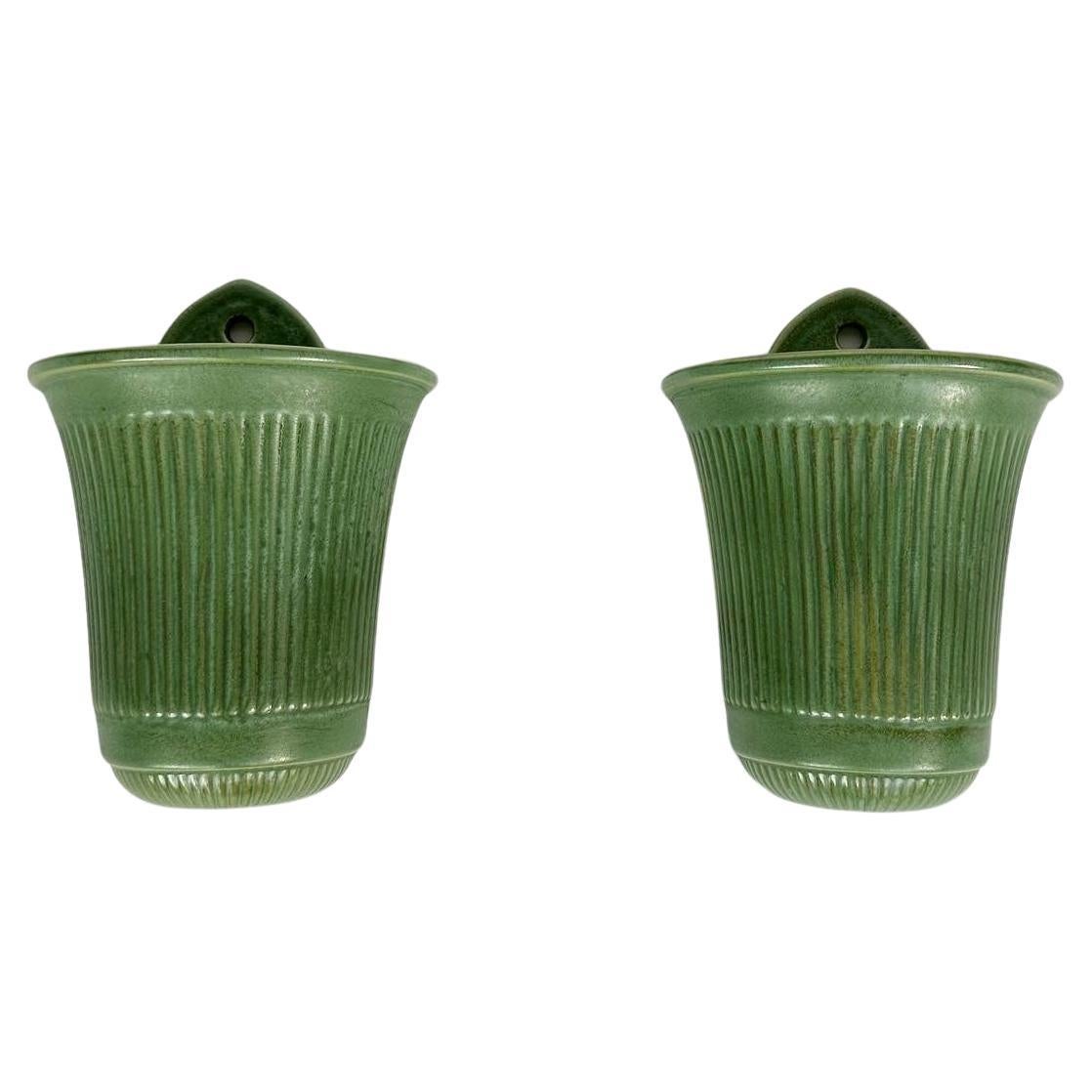 Rare pair of Arthur Percy wall vases for Gefle ceramics in Sweden, designed around 1936.

This model appears first in the 1936 Gefle product catalogue, shown in last photo.

They come with the original ceramic insert for perfectly arranged