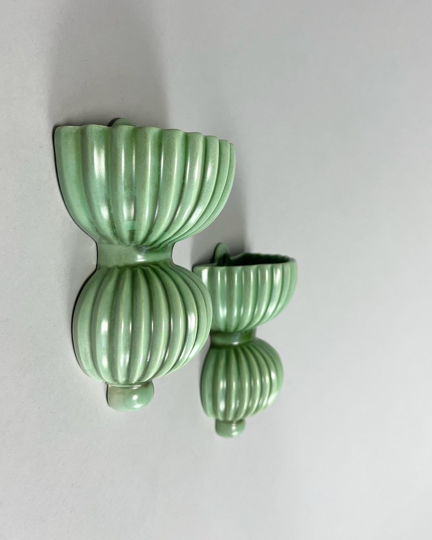 Rare pair of small wall hung vases designed by the artist and designer Arthur Percy in ‚Celadon’ green glaze for Gefle porcelain factory in Sweden, circa late 1940s.

Beautiful hand-crafted with glazing differences, one is slightly