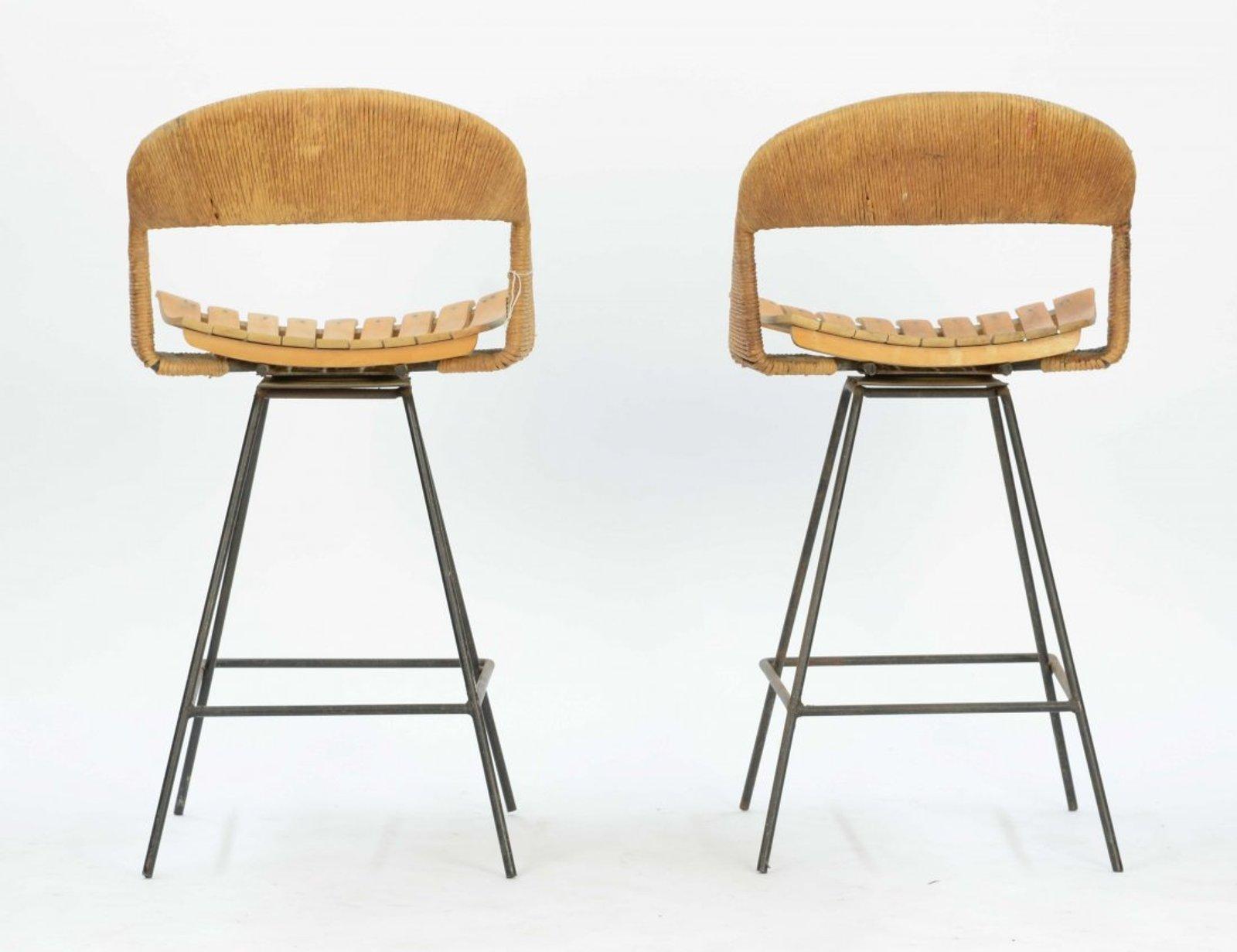 A pair of iron, wood and jute bar stools by Arthur Umanoff.