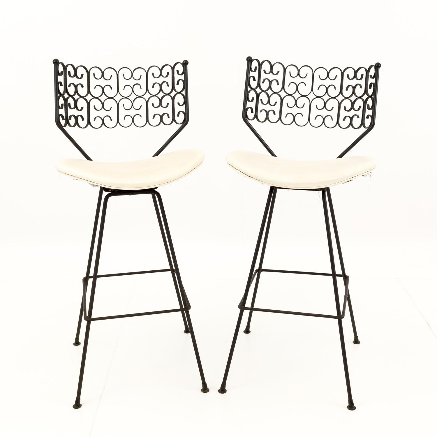 Pair of Arthur Umanoff for Shaver Howard Mid Century iron bar stools - 3 combinations available

Each barstool measures: 19 wide x 22 deep x 41 high and has a seat height of 30 inches
One stool is missing a foot but otherwise, all are in very good