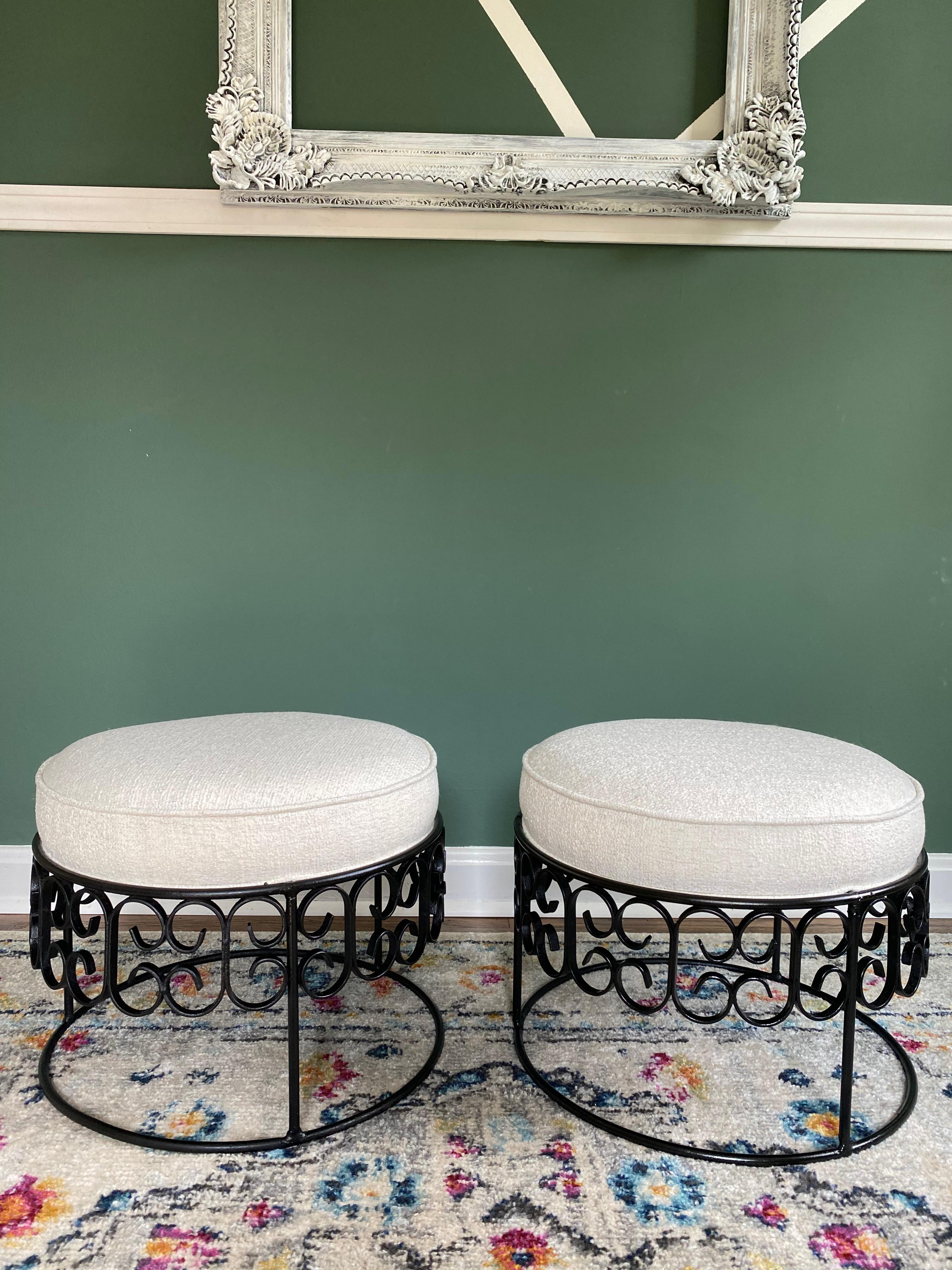 Beautiful pair of reupholstered Arthur Umanoff wrought iron stools. These stools have been reupholstered using Crypton finished off-white boucle fabric, which offers a stain-resistant finish. All new foam and cotton batting.