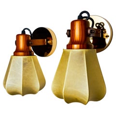 Pair of articulated "Cocoon" wall lights in resin and pine, Italy, 1970