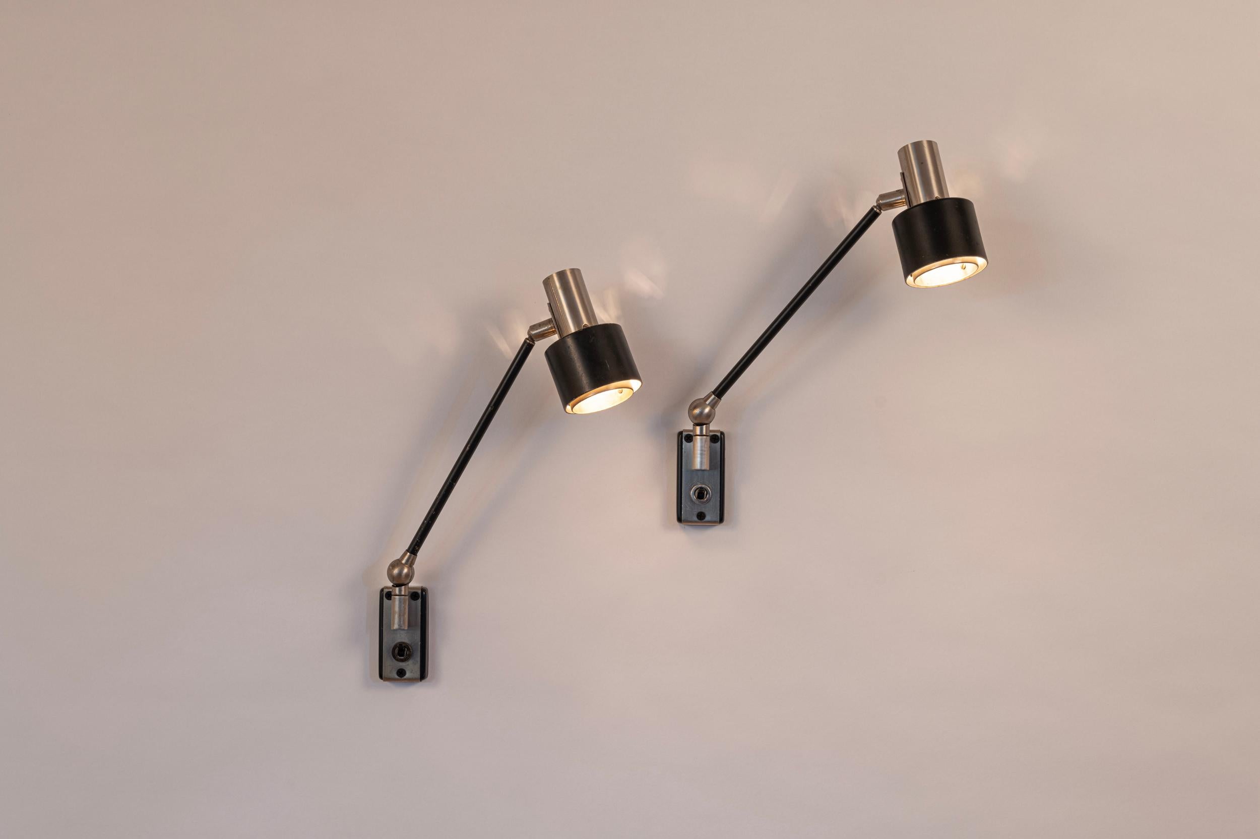 Chic pair of Stilnovo wall lights. Nickelled brass and painted brass. 

Adjustable with switch to each. Re wired for US and Europe
