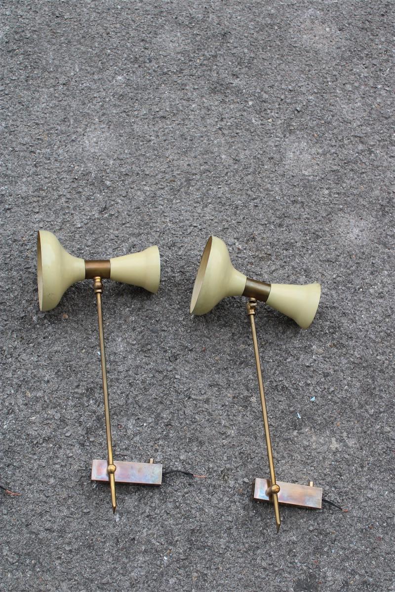 Pair of Articulated wall lamps in Mid-century Italian White Brass Gold Stilnovo.