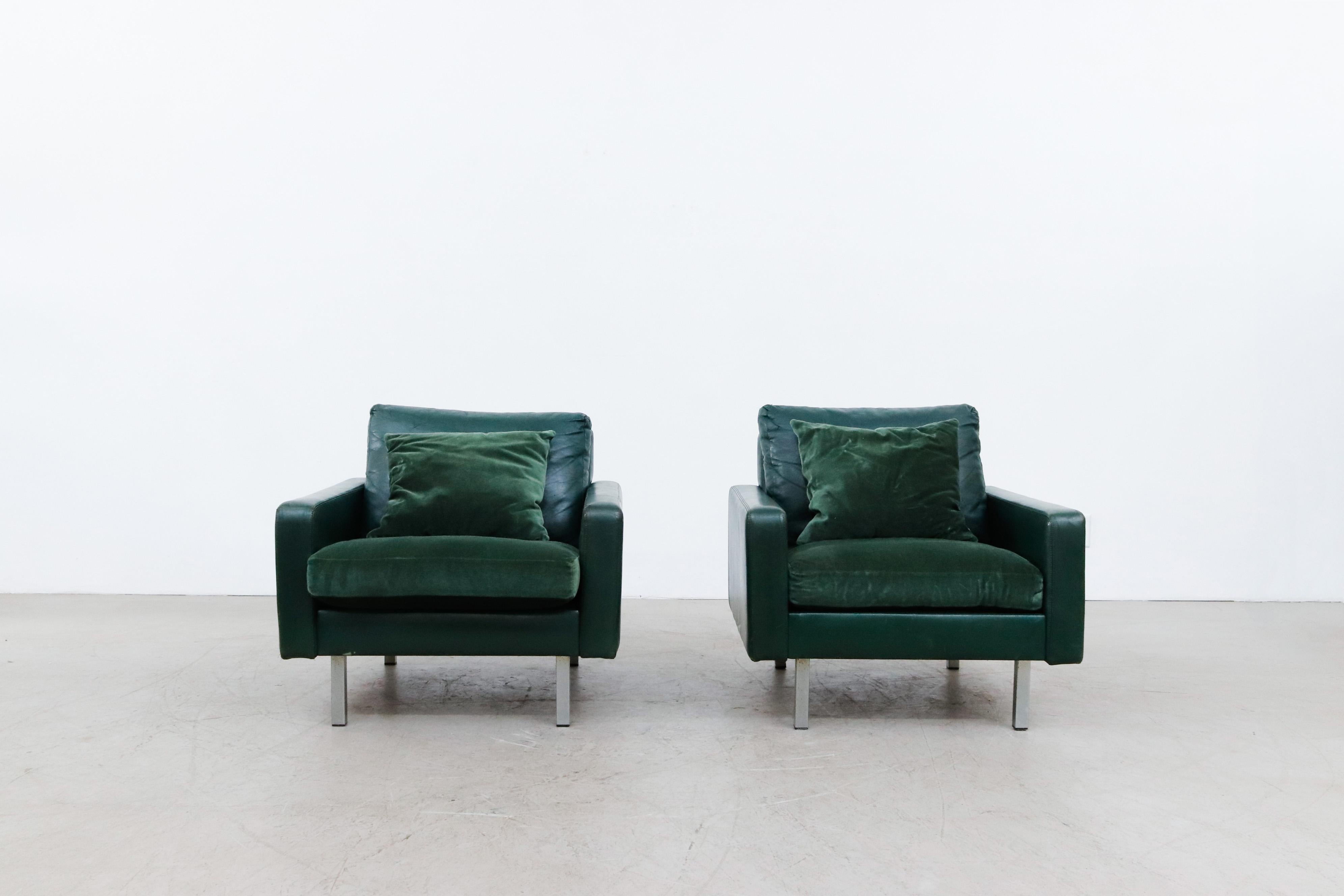 Pair of Artifort Green leather and emerald velvet lounge chairs with chrome legs. In original condition with visible patina and wear consistent with their age and use. Set price. Shown with Philips Salmon table lamp.
