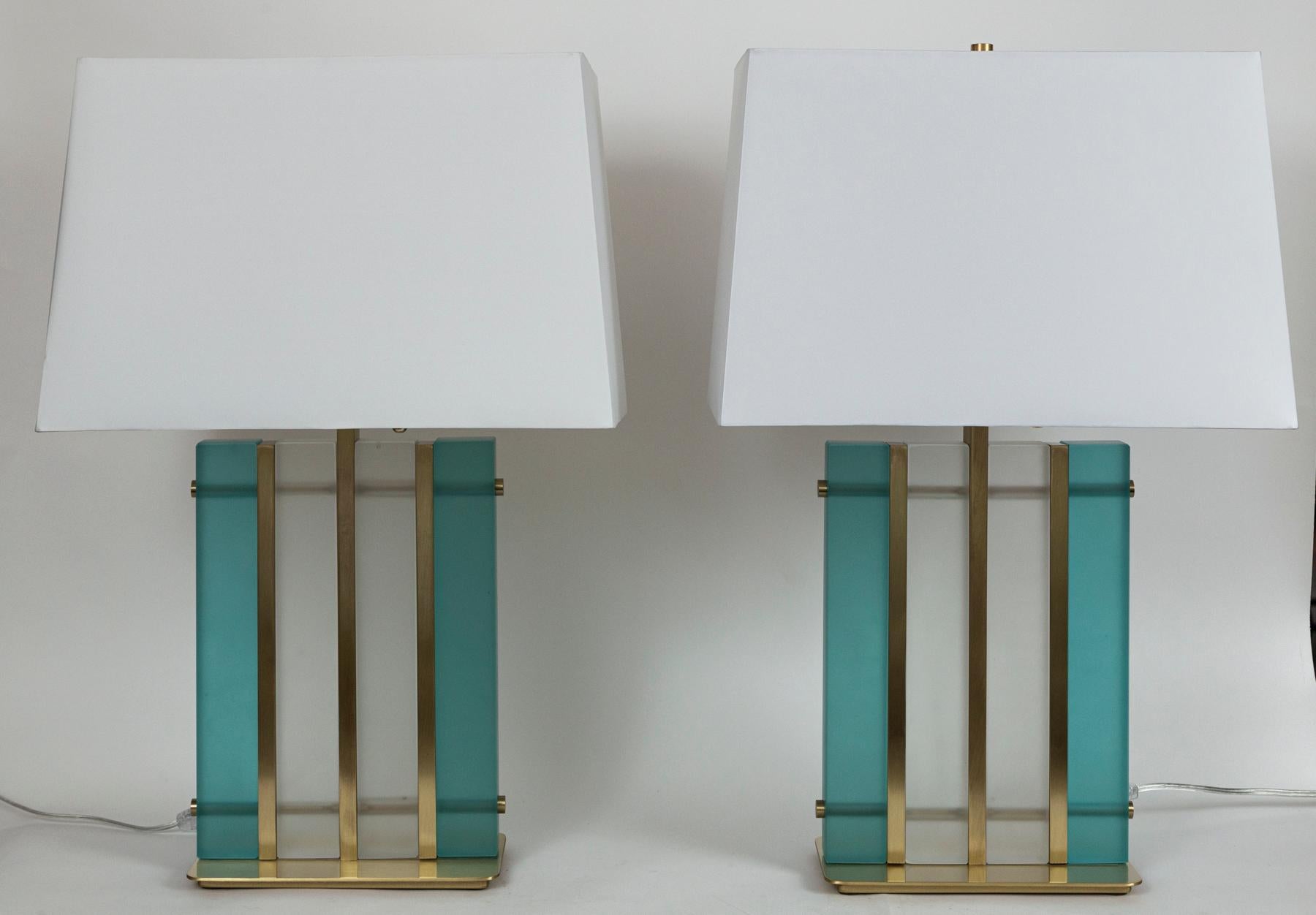 Gorgeous pair of acquamarine & satin clear block lamps in a brushed brass finish.

Electrified to US code with UL approved parts, hardware in polished brass with pull chains and an on/off cord switch.
*heavy with weighted base
Dating: new,