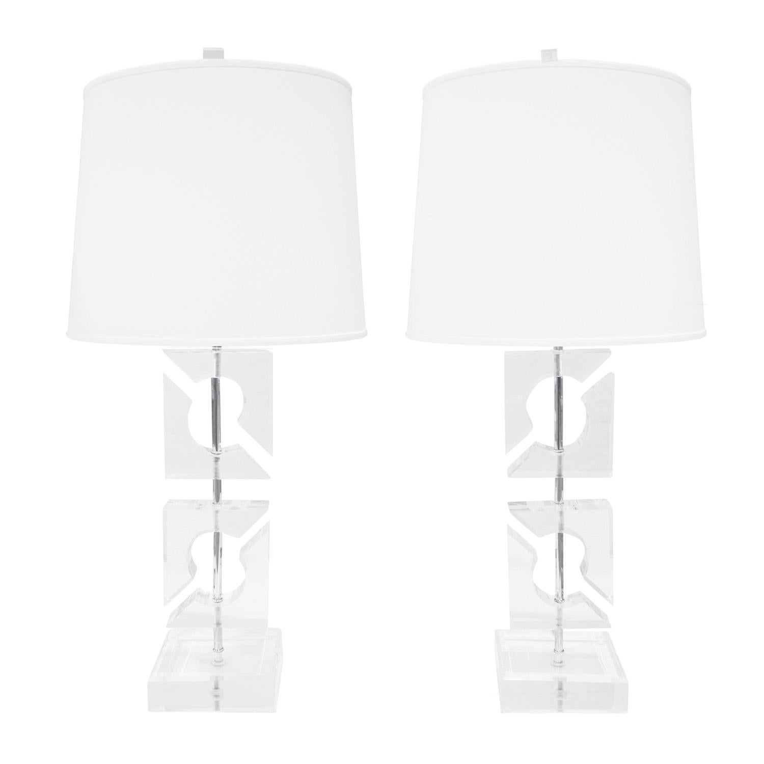 Pair of artisan made sculptural table lamps, solid lucite graphic forms mounted with chrome hardware, American 1970's. These lamps are very chic. The lucite is crisp and clear.

Dimensions for each:

W: 7 inches
D: 7 inches
H: 36 inches
Shade