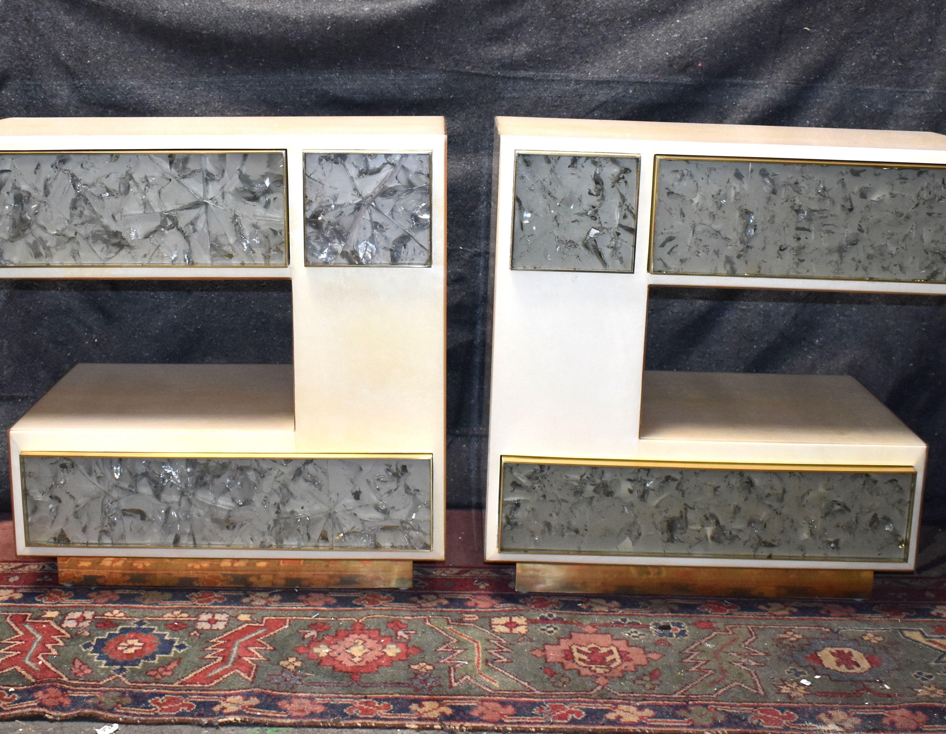 Pair of beside tables cover with goatskin and ice cracked resin details. Also can be use as side tables parchment cover all around tables and each table has two drawers with brass details.
Natural Parchment (High gloss polyester resin filled
