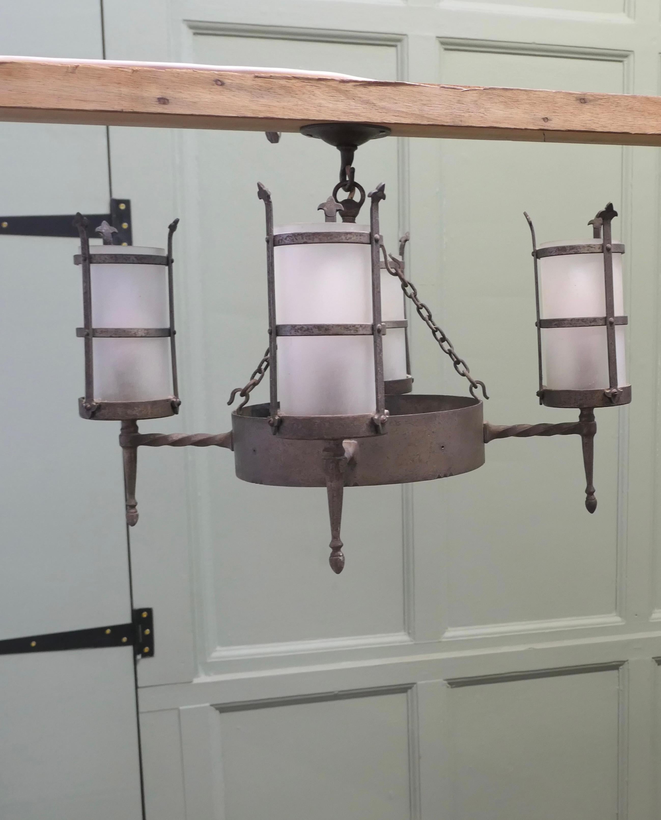 Iron Pair of Arts and Crafts 4 Arm Ceiling Lights  An unusual pair of pendant lights For Sale