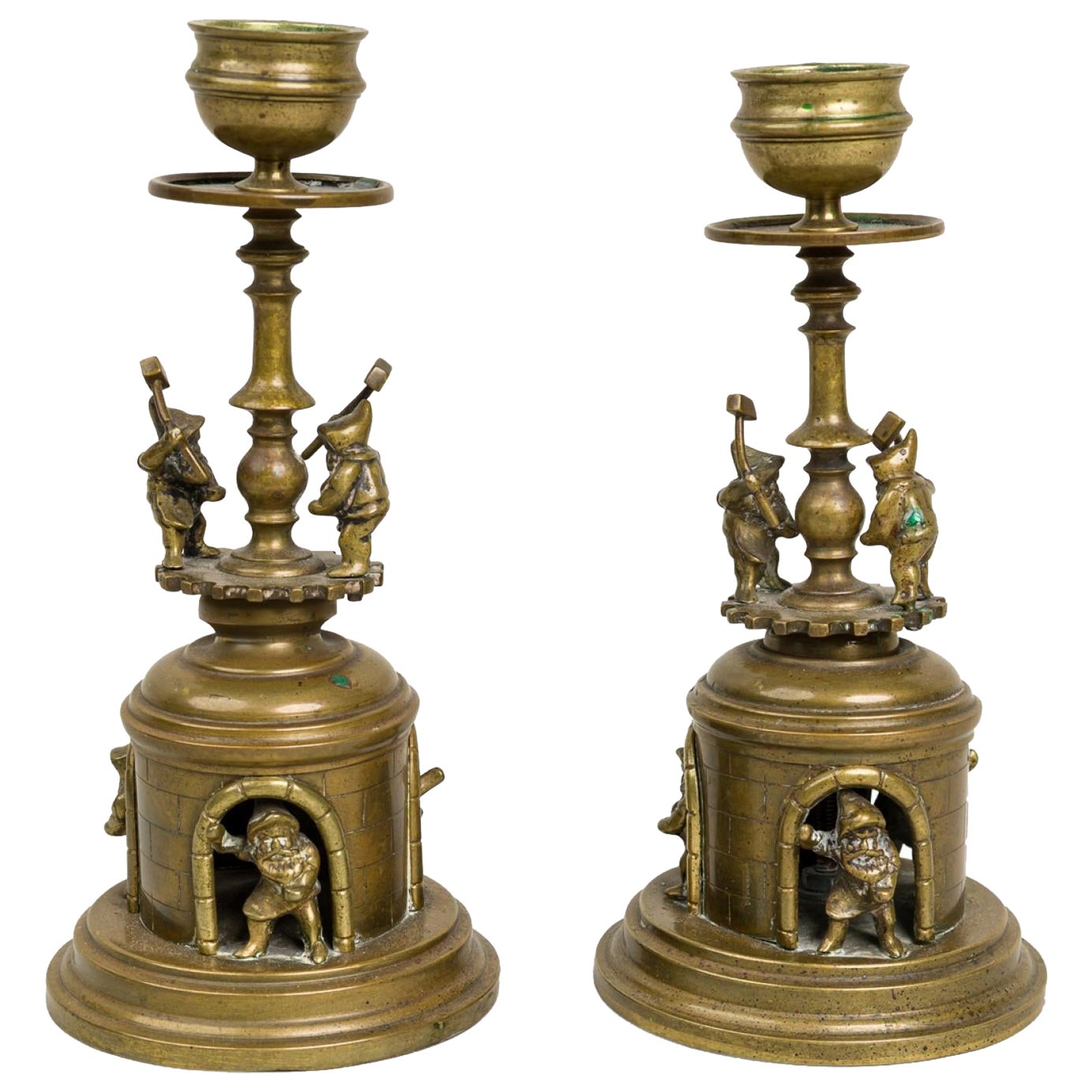 Pair of Arts and Crafts Brass Gnomes and Dwarves Embellished Candlesticks For Sale
