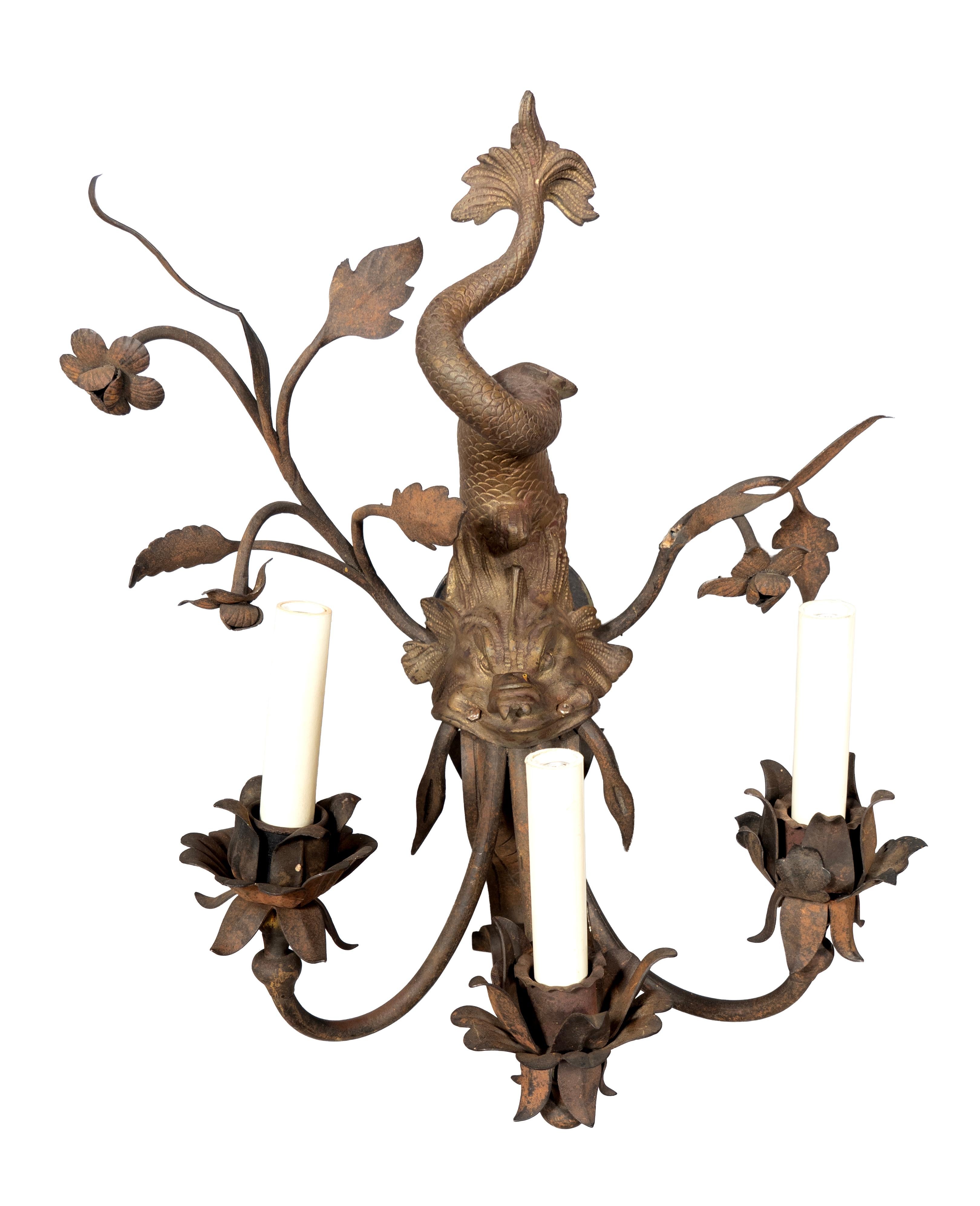 Each with central gilt bronze dolphin now oxidized with three candle arms. Trailing leaves and branches. Newly wired.