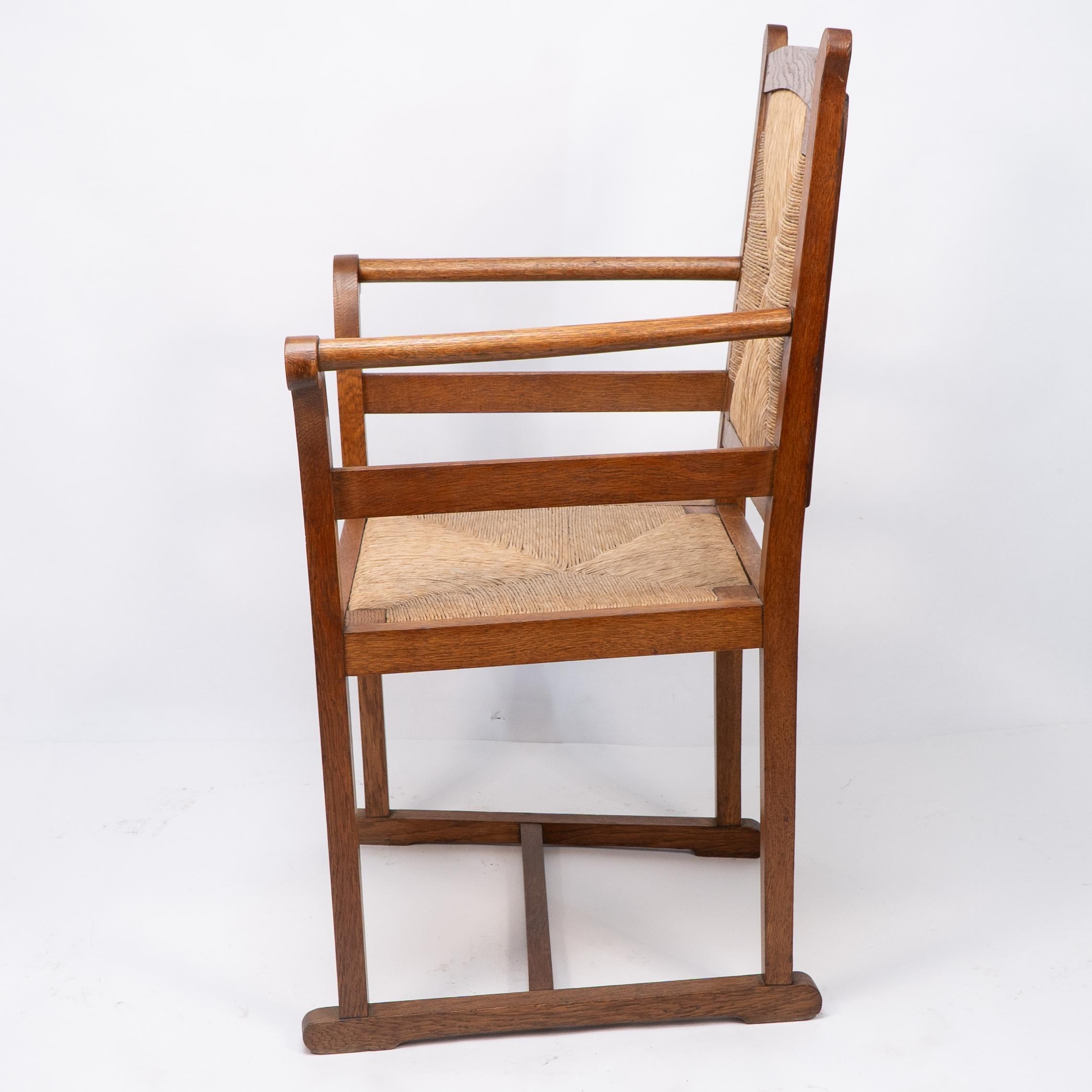 Rush Pair of Arts and Crafts Oak Elbow Chairs, in the Manner of George Walton For Sale