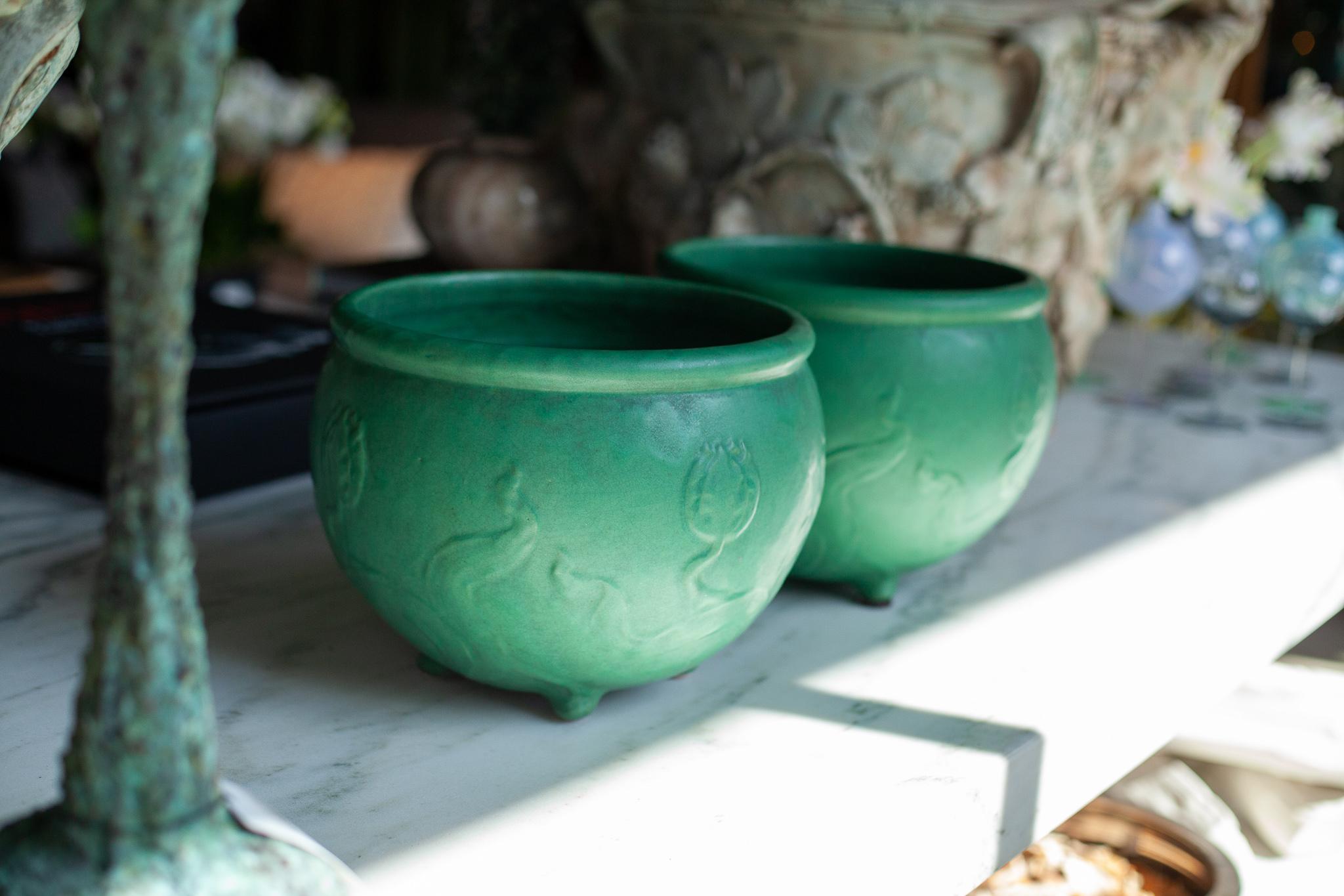 Fleurdetroit presents for your consideration this pair of Owens jardinieres from the American Arts and Crafts Movement. 

A rare opportunity to have not one, but two matching jardinières made by the Owens pottery company. A delightful tulip motif