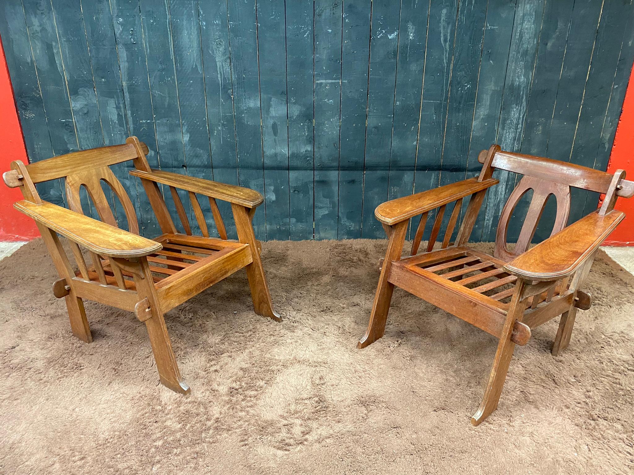 pair of Arts & Crafts style armchairs in teak, circa 1950.
price is for the pair