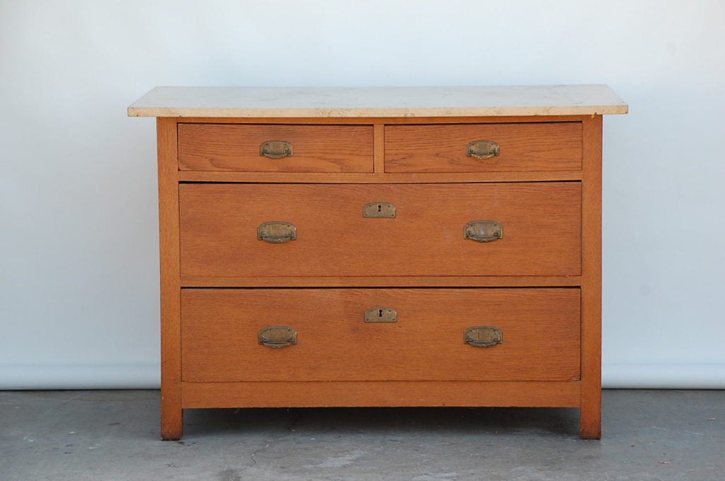 Hard to find pair of Arts & Crafts oak and travertine chest of drawers.