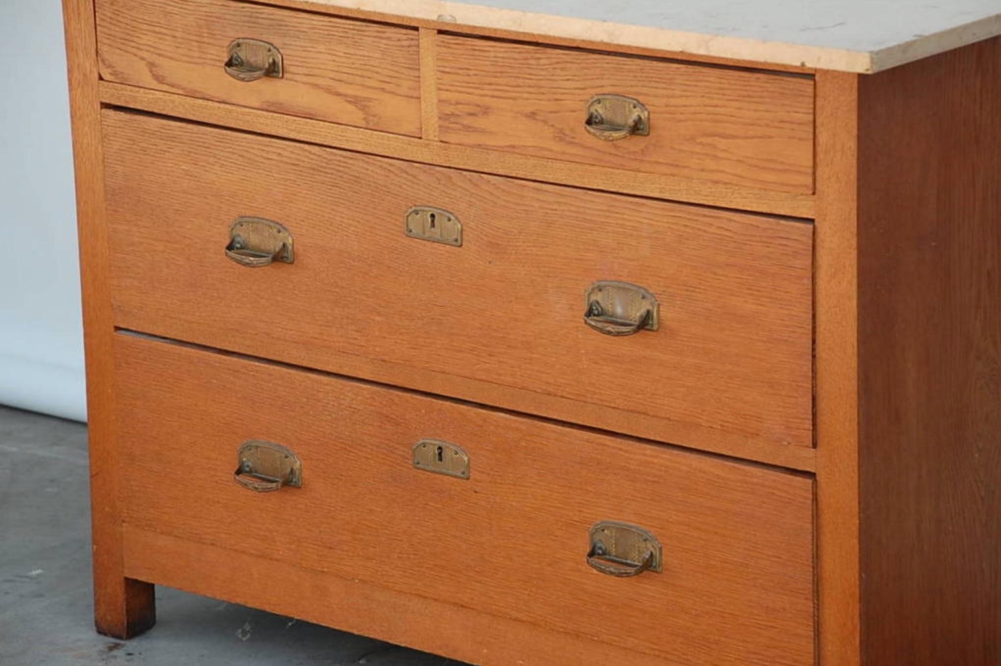 Pair of Arts & Crafts oak and travertine chest of drawers For Sale 1
