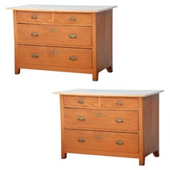 Pair of Arts & Crafts oak and travertine chest of drawers