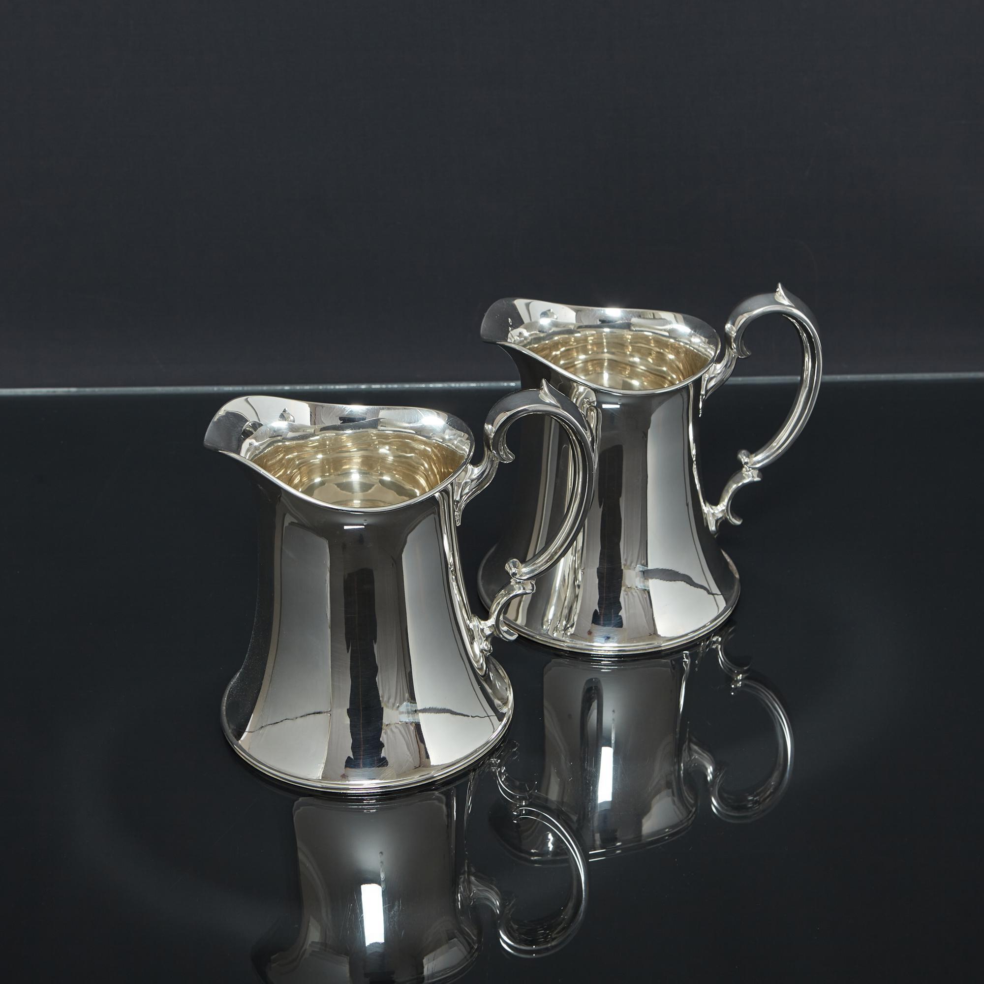 Sterling Silver Pair of Arts & Crafts silver water jugs For Sale