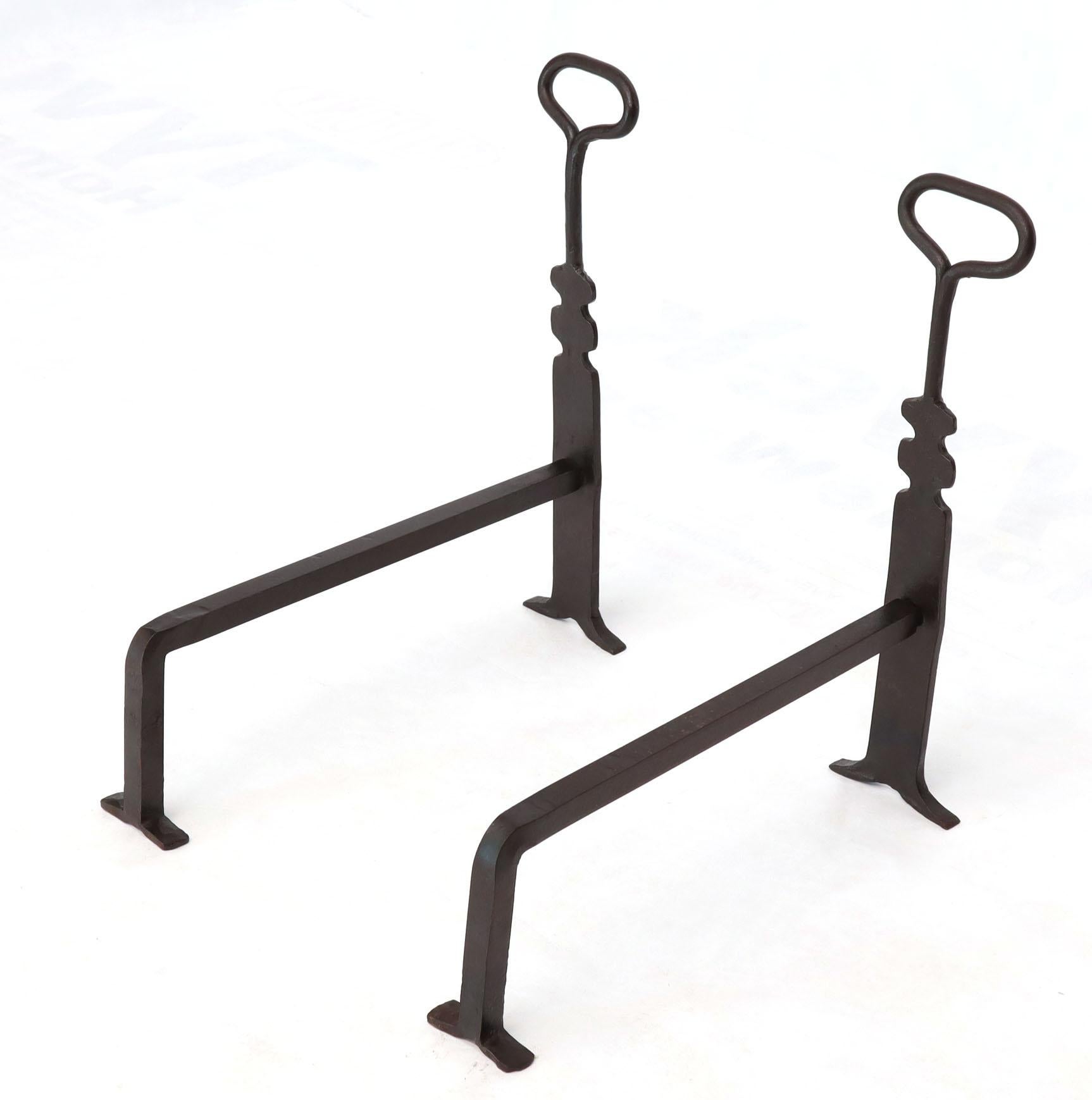 Pair of Mid-Century Modern style wrought iron Arts & Crafts and irons.