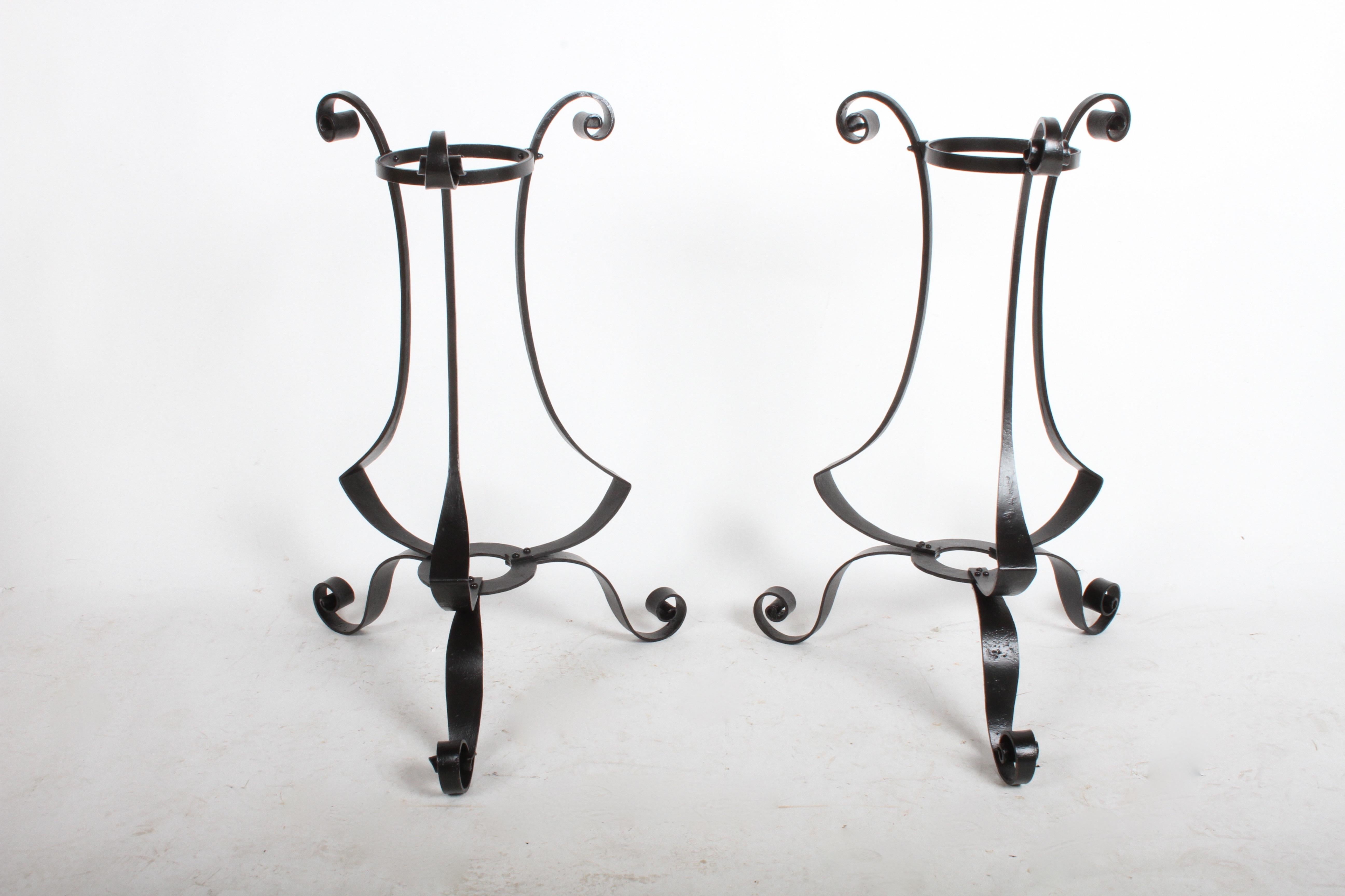Nice pair of Arts & Crafts period hand forged scroll design wrought iron planters or plant stands. These have been sandblasted, dipped in rust primer, and painted satin black. Planters hold 8