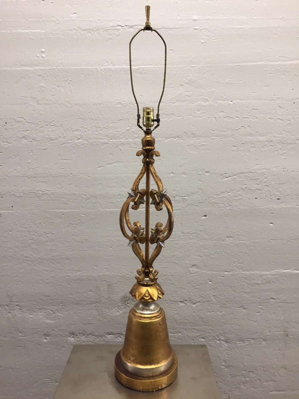 Pair of Hollywood Regency wrought iron gold leaf lamps.
Measures: 44.5H (to top of finial). Under socket: 32 height, diameter: 8.5
Shades not included. Arturo Pani Style.