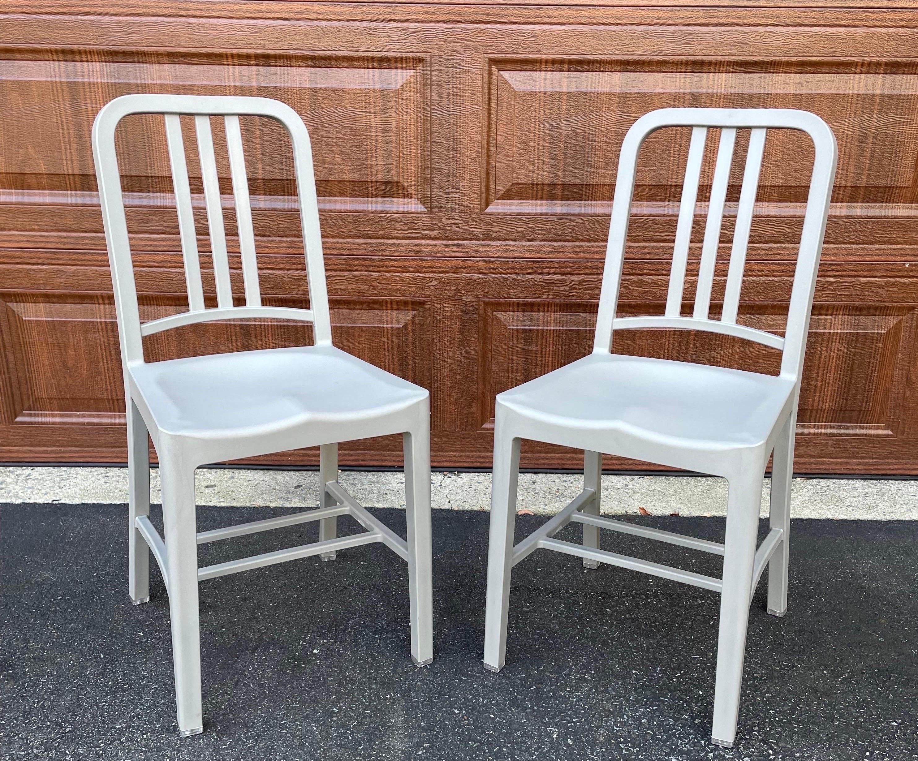 Pair of gray Emeco Navy 111 chairs. Excellent condition, very light if any use. Measures: 15.5” W x 19.5” D x 34” H - seat height 18”.