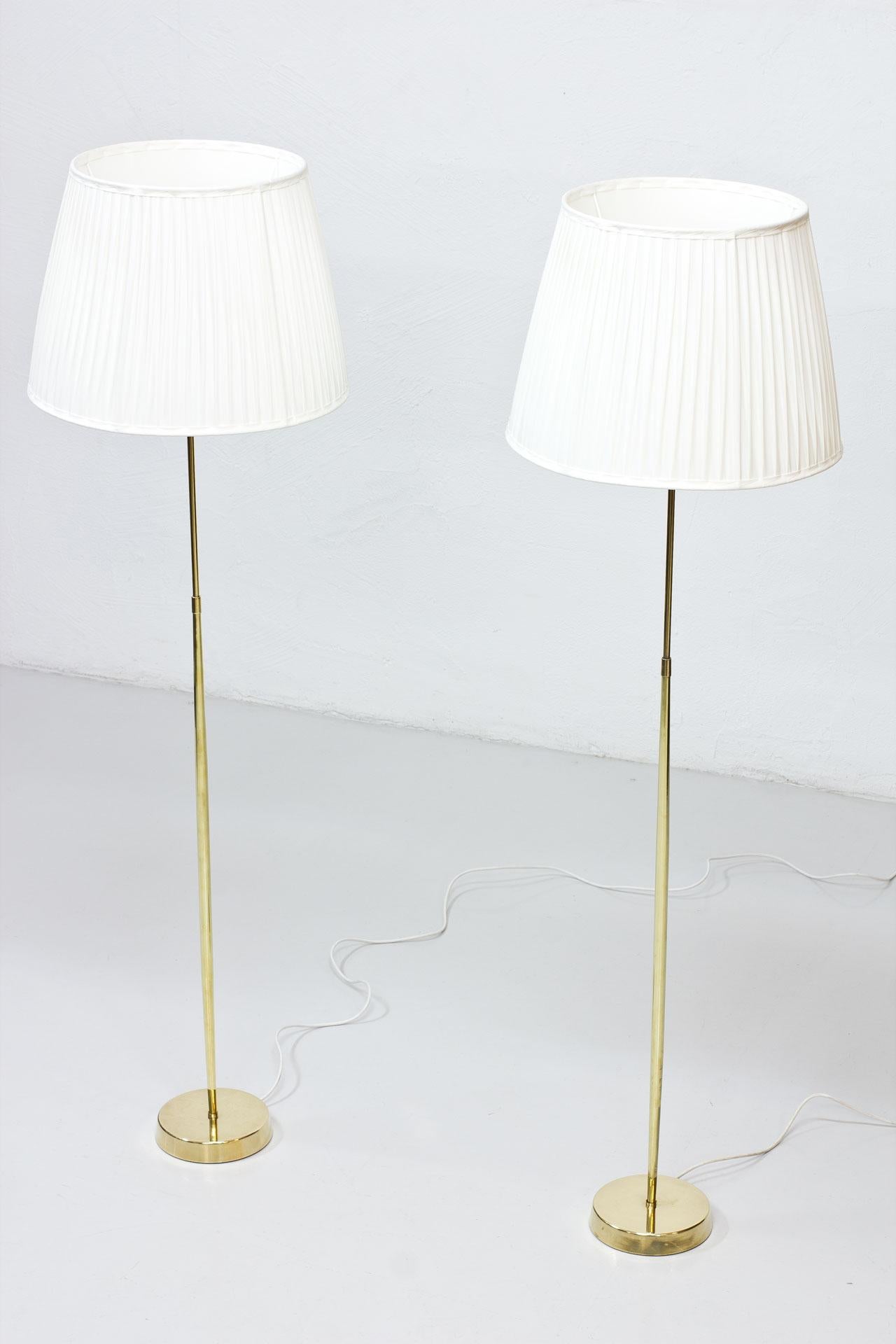 Swedish Pair of ASEA Belysning Brass Floor Lamps, 1950s, Hand-Pleated Chintz Shades For Sale