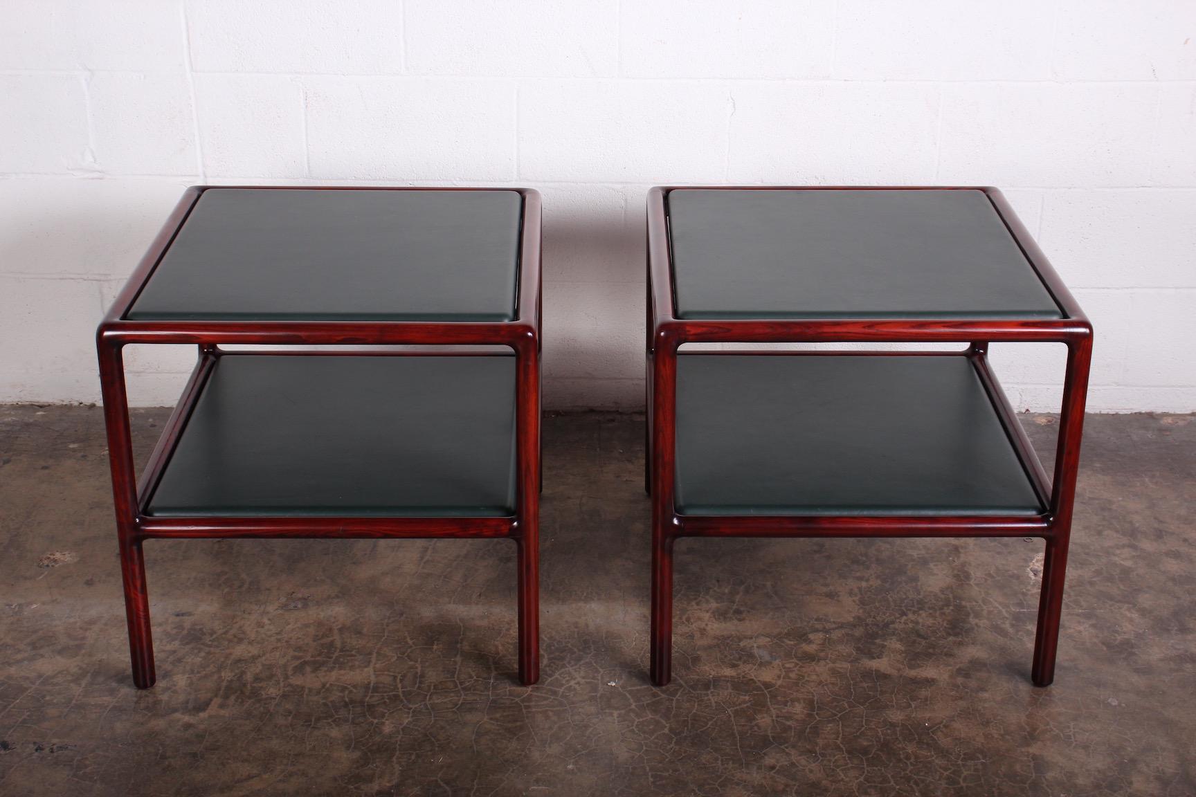 A pair of ash framed tables with inset green leather tops. Designed by Ward Bennett for Brickel.