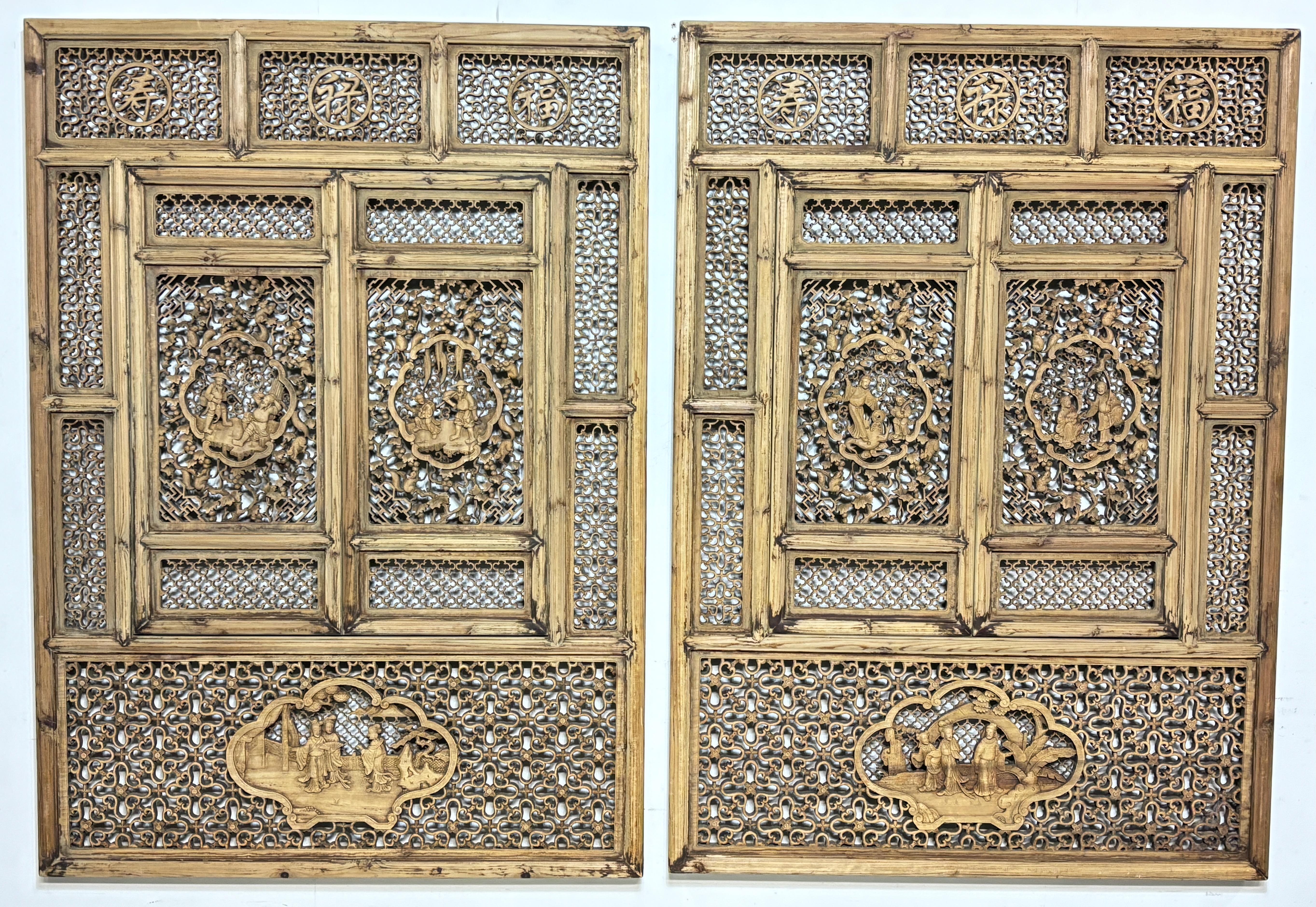 A pair of elaborately carved and detailed solid teak wood and cypress windows. Completely hand crafted with amazingly precise hand cut open work, mortise and tenon joinery (no nails or metal hardware used at all). Windows open inward on pin