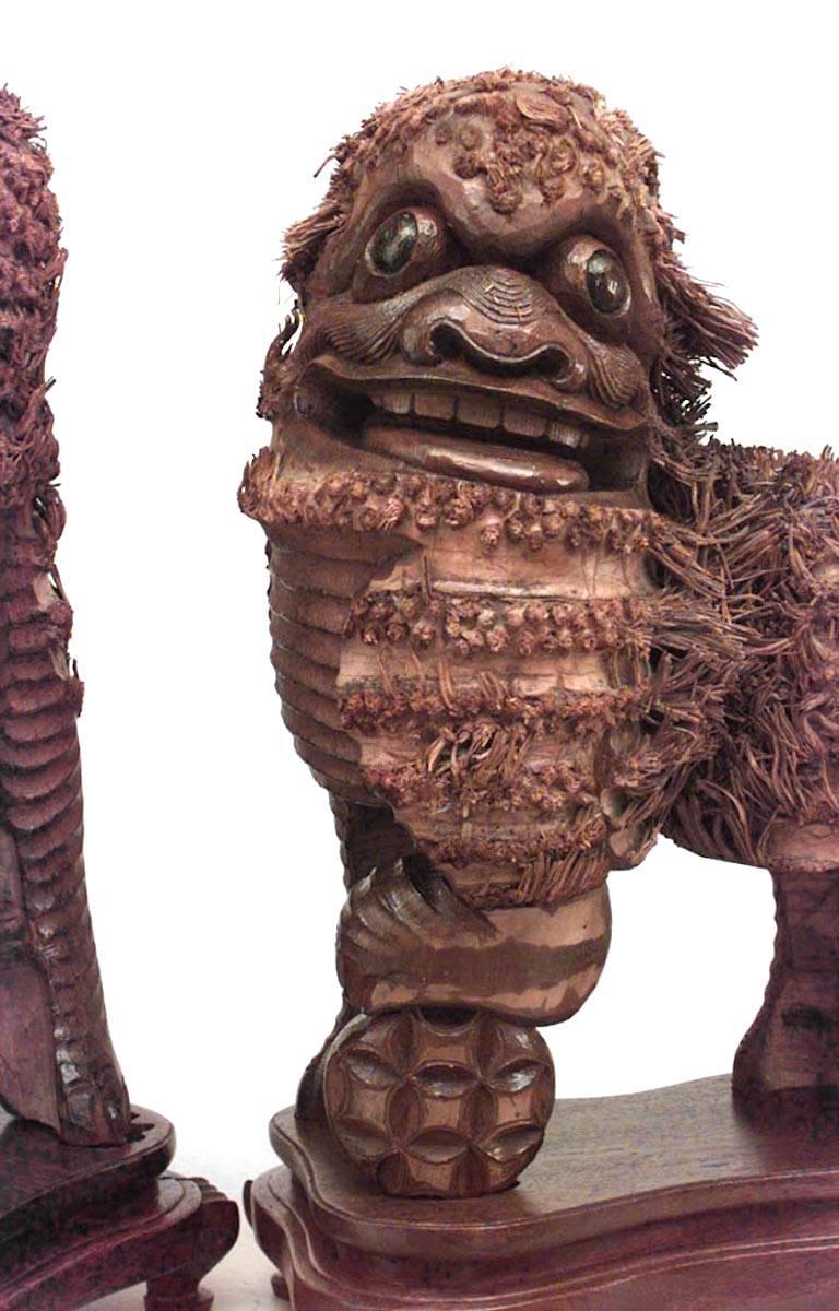 Pair of Chinese Carved Wood Foo Dogs For Sale at 1stDibs