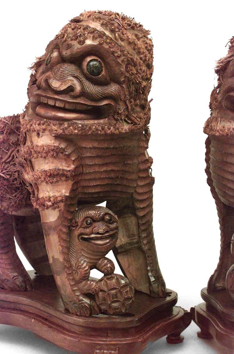 Hand-Carved Pair of Chinese Carved Wood Foo Dogs For Sale