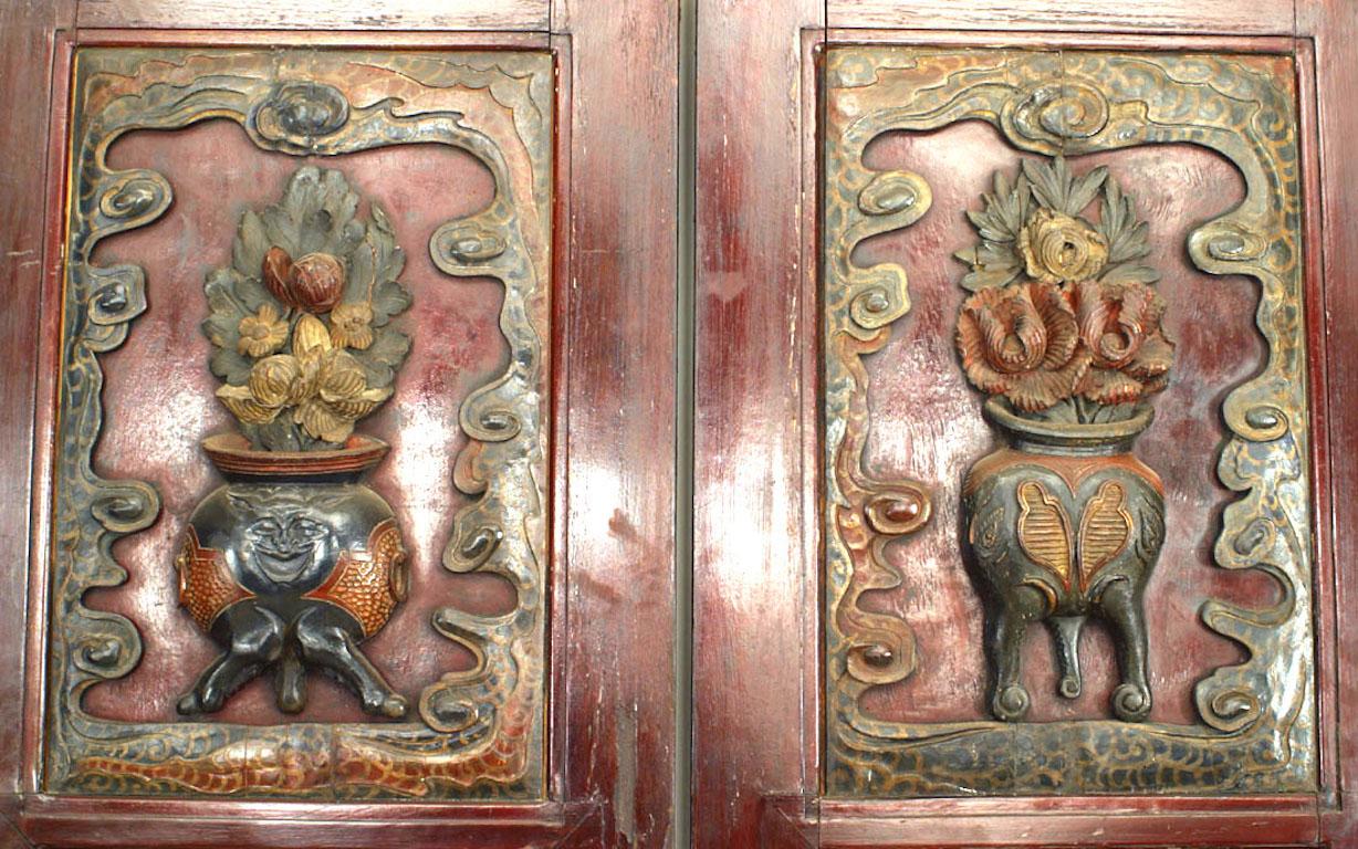 Pair of Asian Chinese style (late 19th/early 20th Century) red painted doors inset with pierced & relief carved polychrome lacquered panels (PRICED AS Pair).
