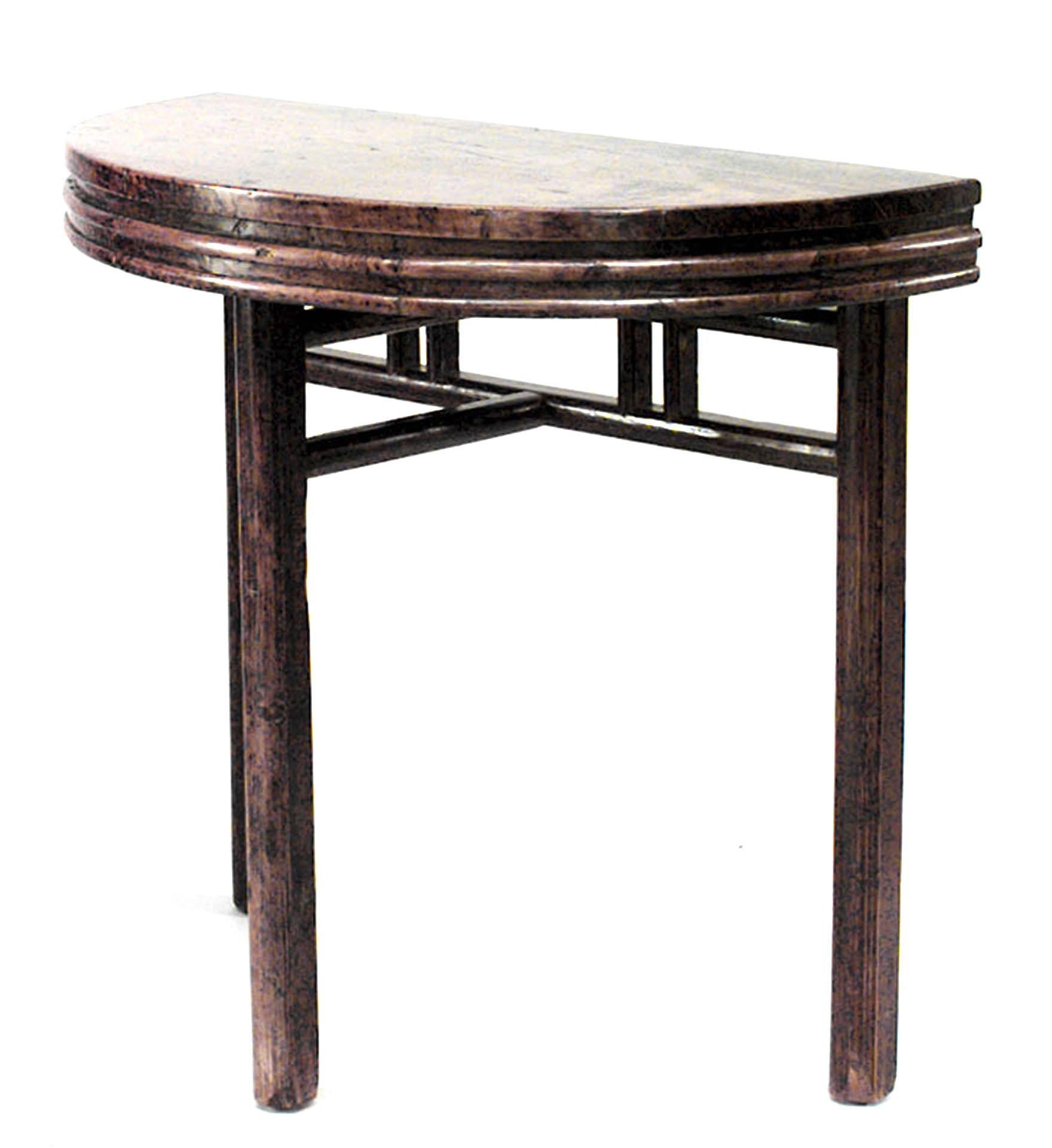 Pair of Asian Chinese style (19th century) teak half round three-legged console tables with fluted apron.
 