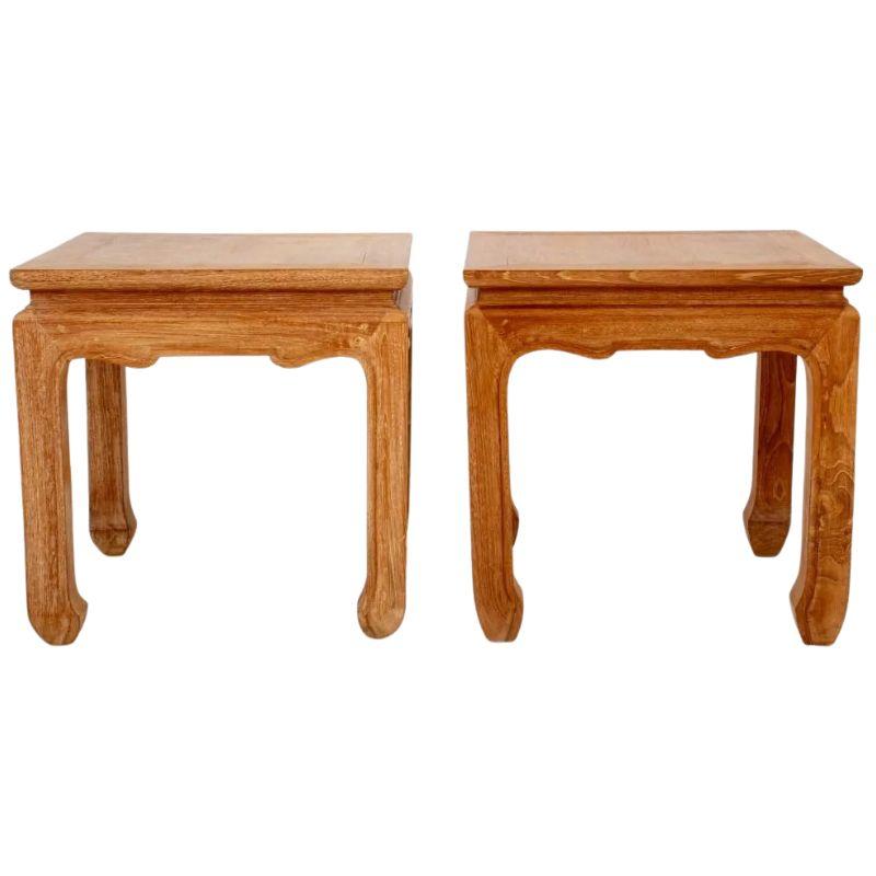 A pair of Chinese cypress square side tables in Ming style with shaped apron and curved feet.