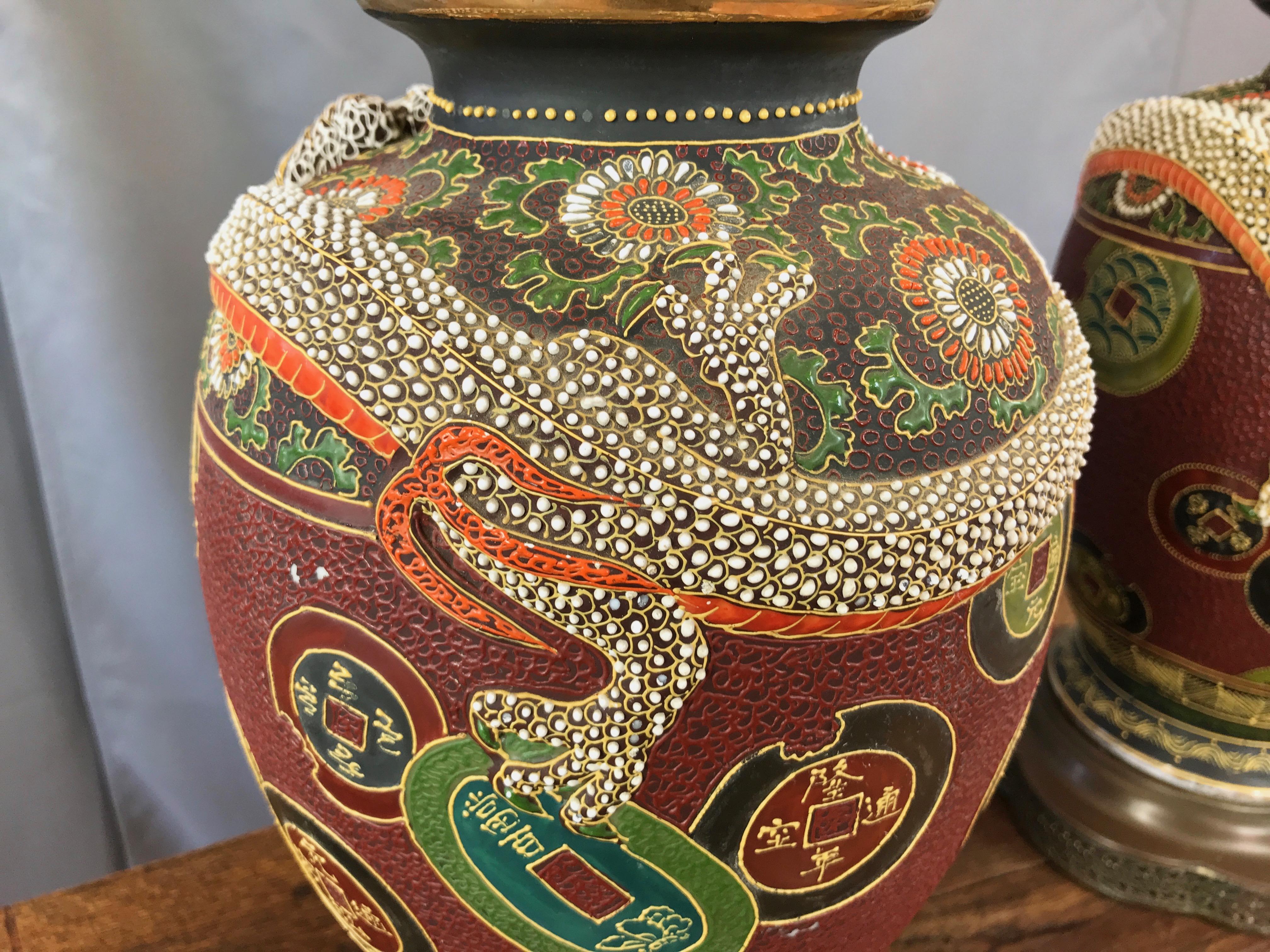 Mid-20th Century Pair of Asian Dragon and Charm Motif Hand-Decorated Ceramic Table Lamps