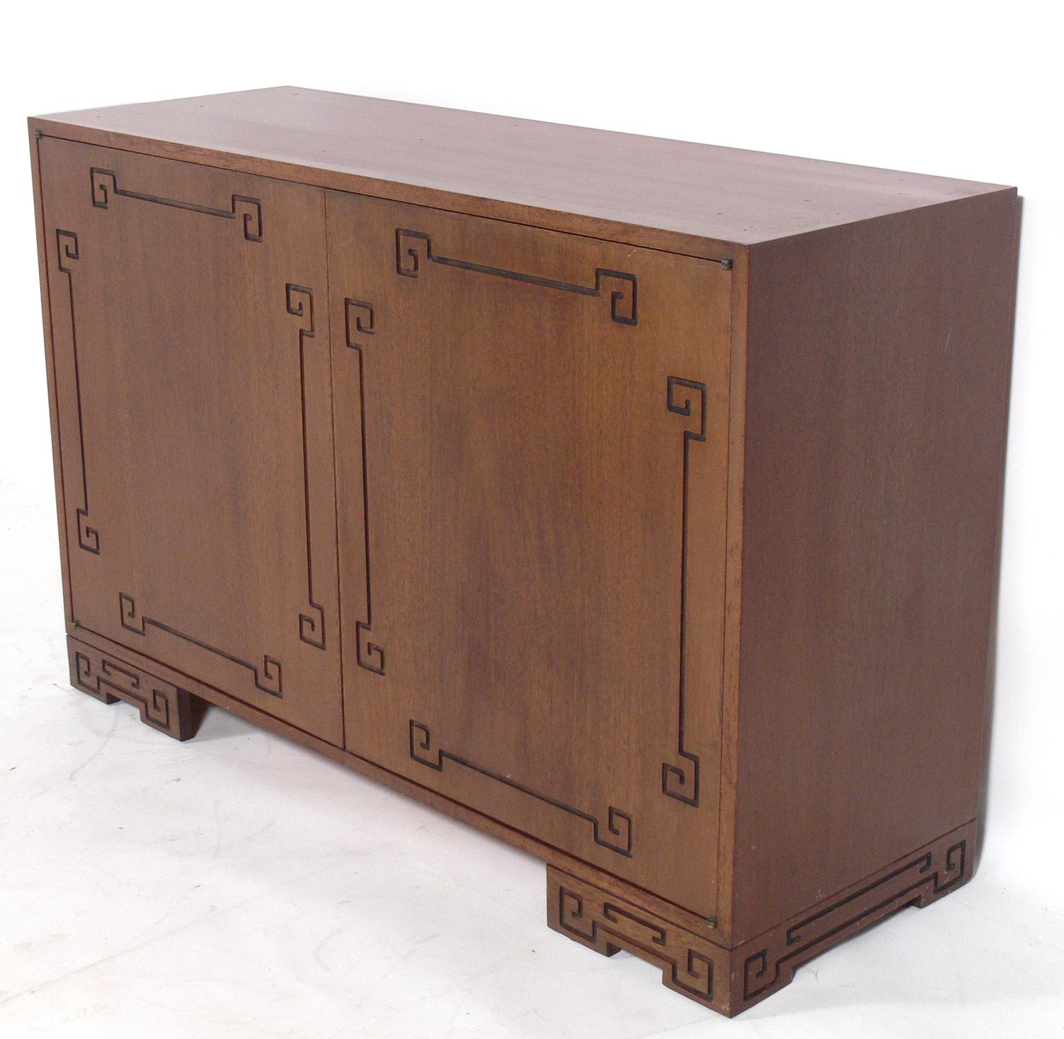 Pair of Asian influenced cabinets, to be refinished in your choice of color, American, circa 1950s. They are a versatile size and can be used in a living area as a credenza, bar cabinet, or media cabinet, or in a bedroom as chests or dressers. The