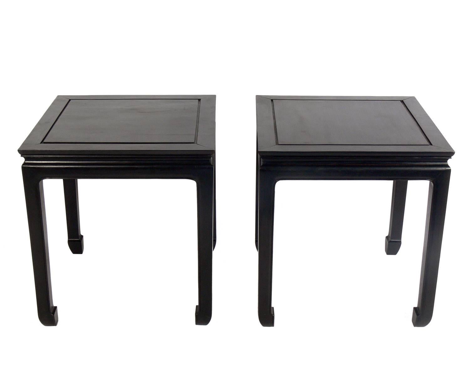 Pair of Asian influenced end tables or nightstands, Asian, circa 1950s. They are a versatile size and can be used as side or end tables, or as nightstands. These tables are currently being refinished and can be completed in your choice of color. The