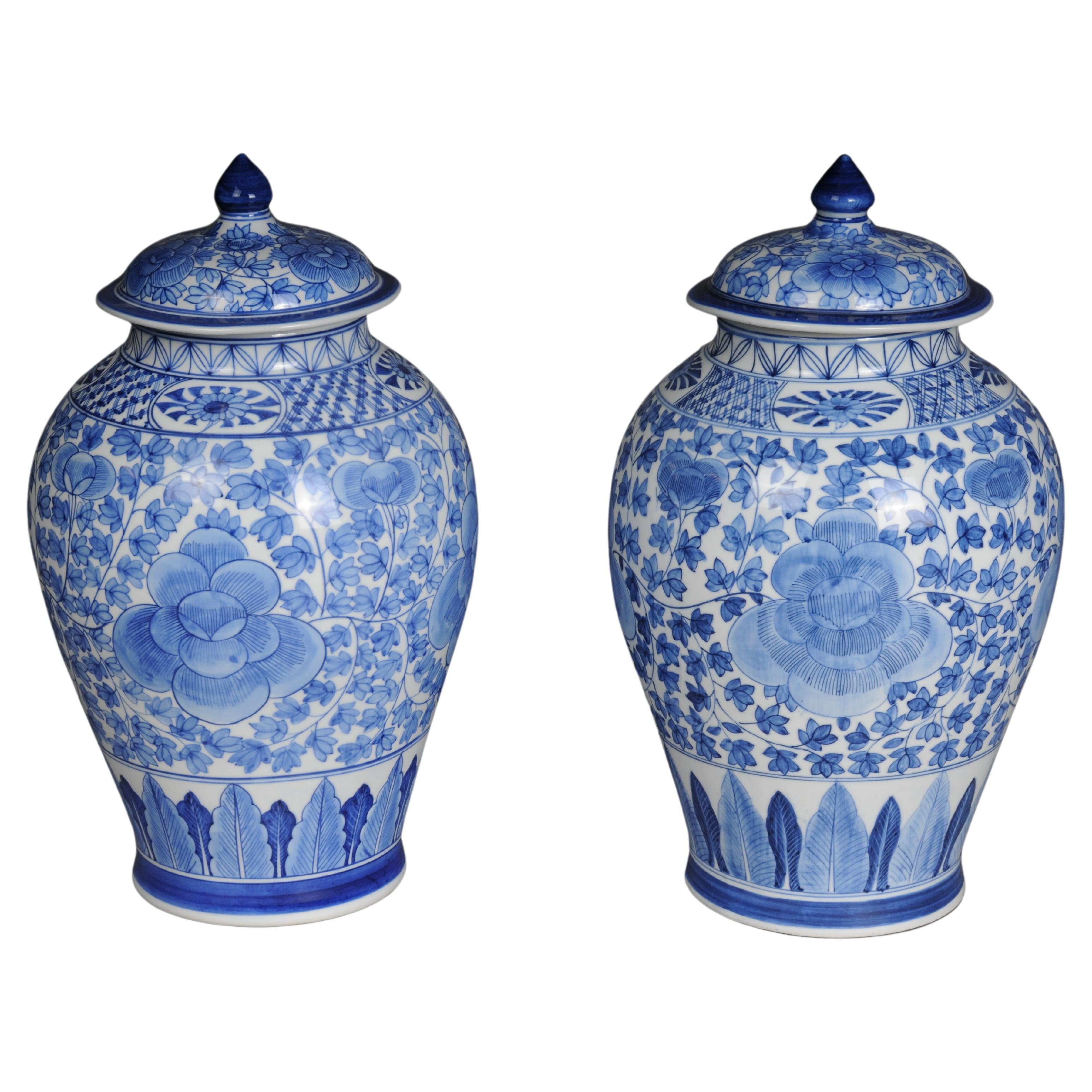 Pair of Asian lidded vases, porcelain, 20th century.