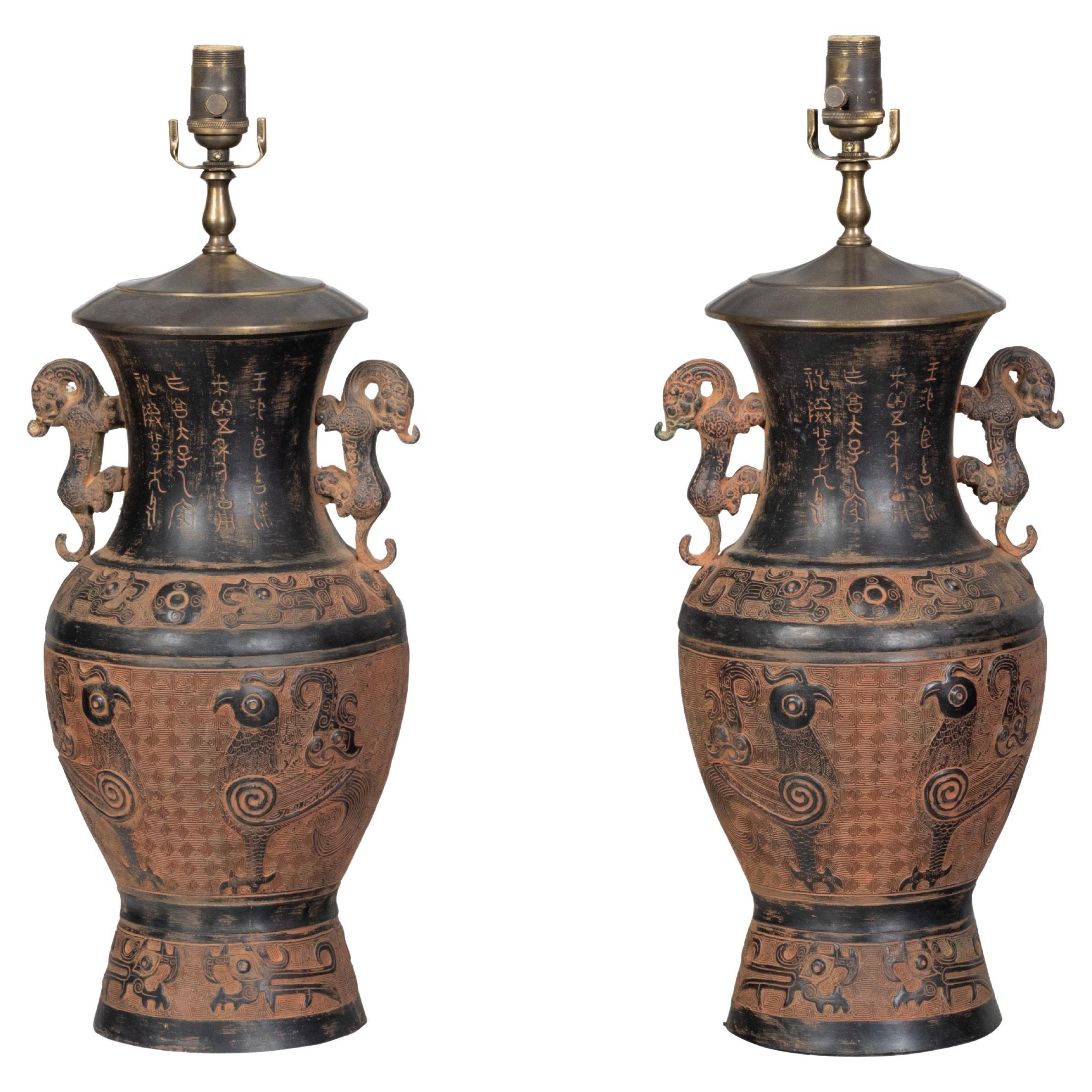 Pair of Asian Midcentury Bronze Urn-Shaped Table Lamps with Rooster and Meander For Sale