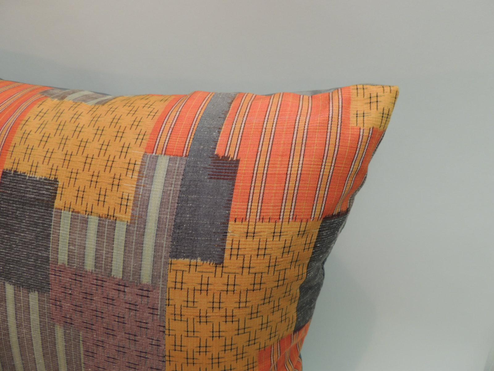 Pair of Asian Patchwork style printed silk pillows with green silk backings. 
