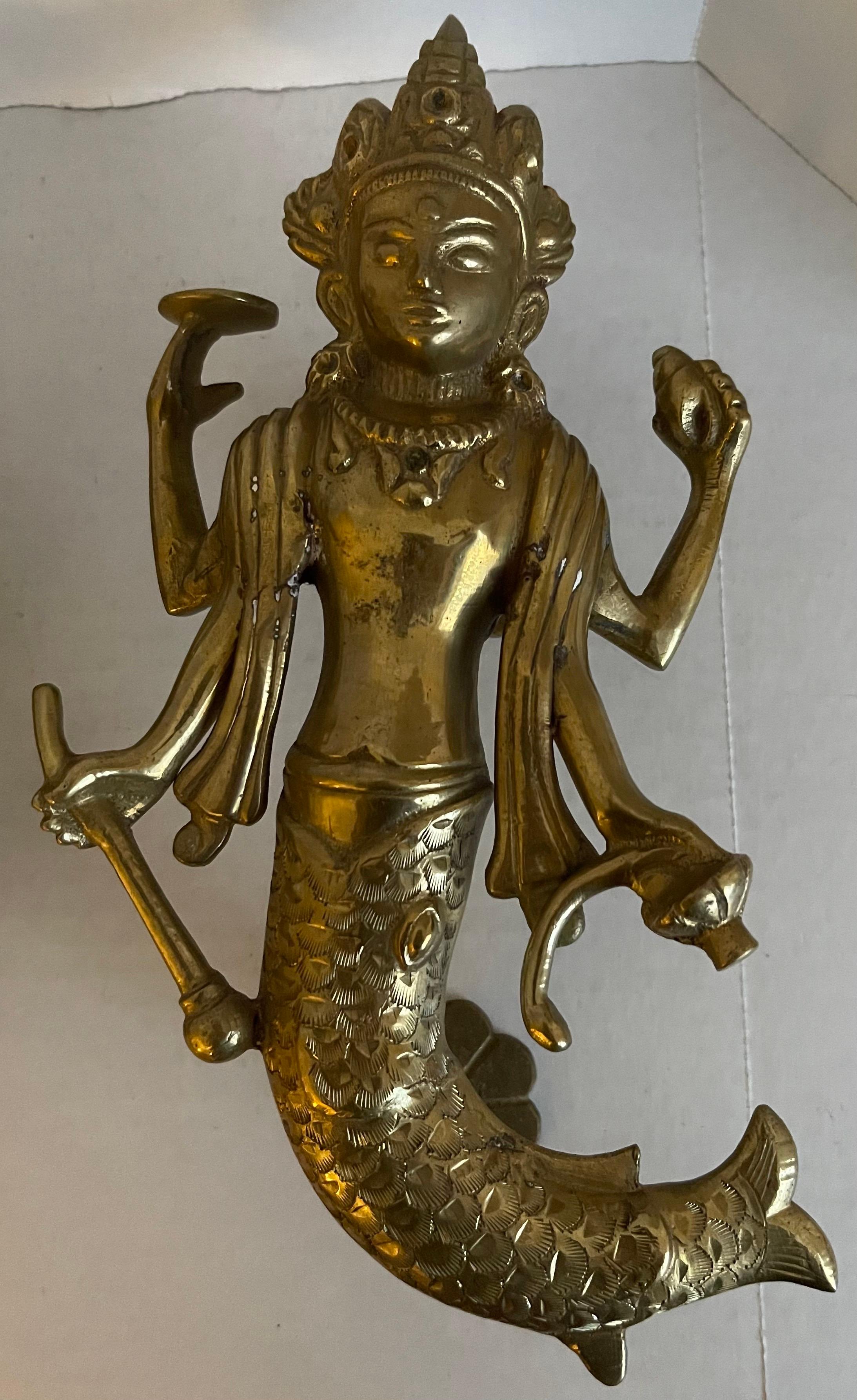 Pair of solid brass Asian goddess door knobs. No makers mark. Mounting hardware not included.