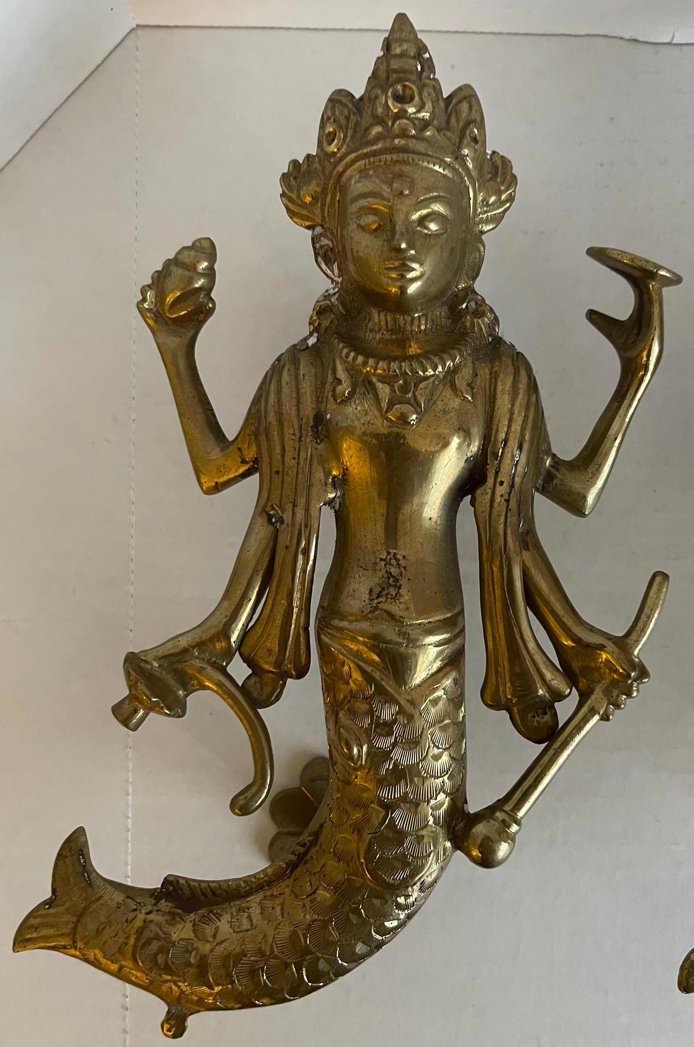 Pair of solid brass Asian goddess door knobs. No makers mark. Mounting hardware not included.