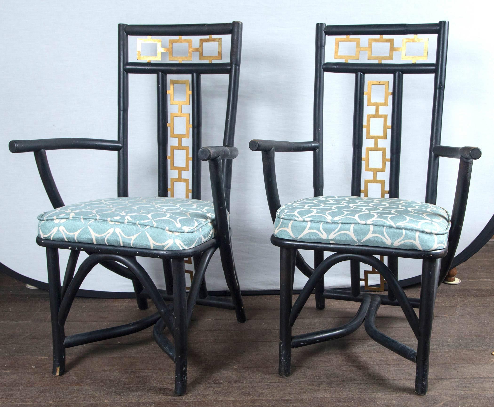 Very stylish James Mont type Asian armchairs. Muscular wood frames with gilt metal geometric fretwork incorporated into back design.
Measures: Seat height: 18.5 inches, arm height: 25.5 inches.