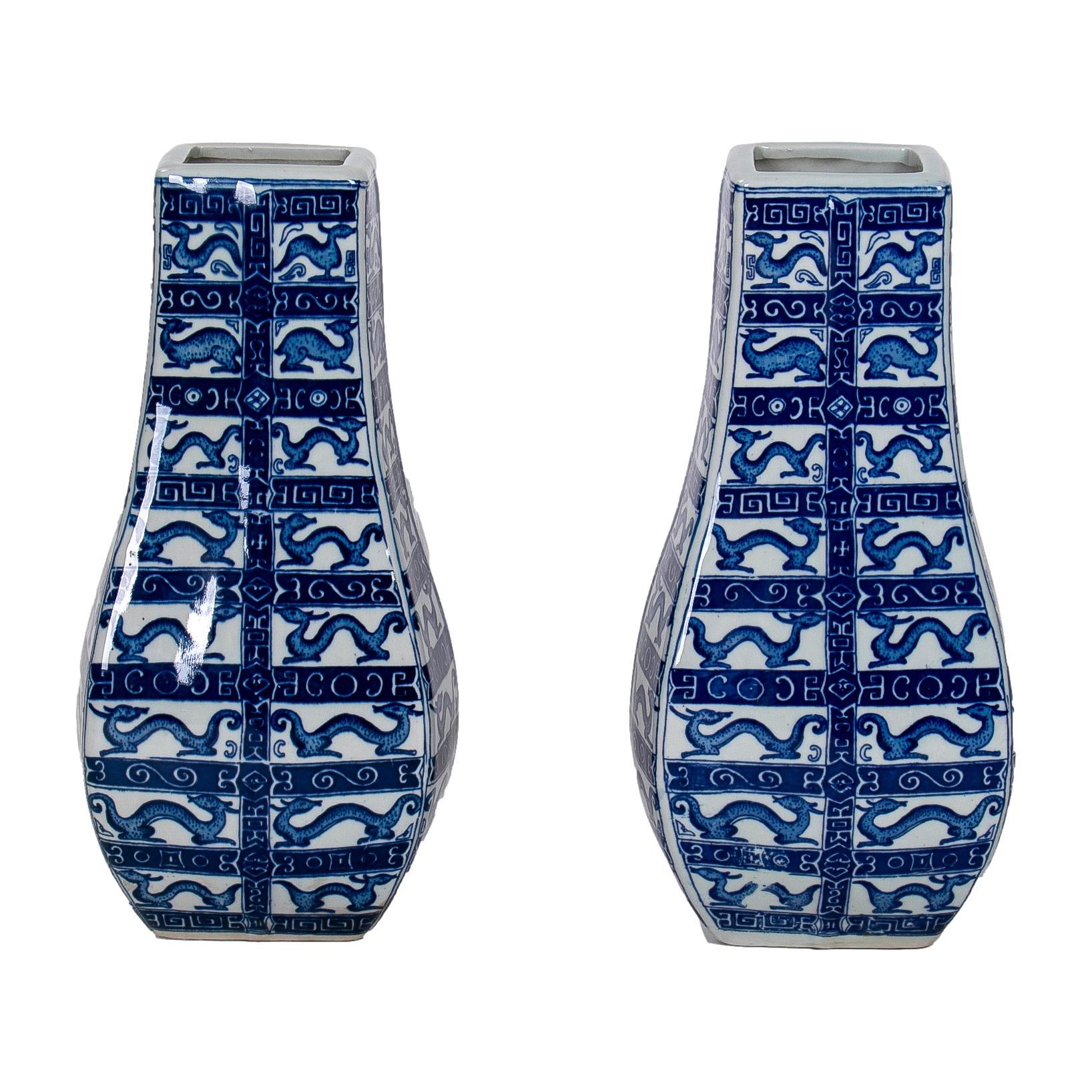 Pair of Asian white and cobalt blue glazed porcelain vases.