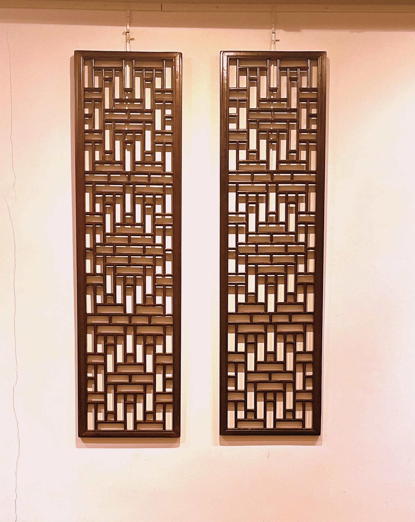 Pair of Asian window panels with geometric shapes design.
All constructed with joinery techniques.