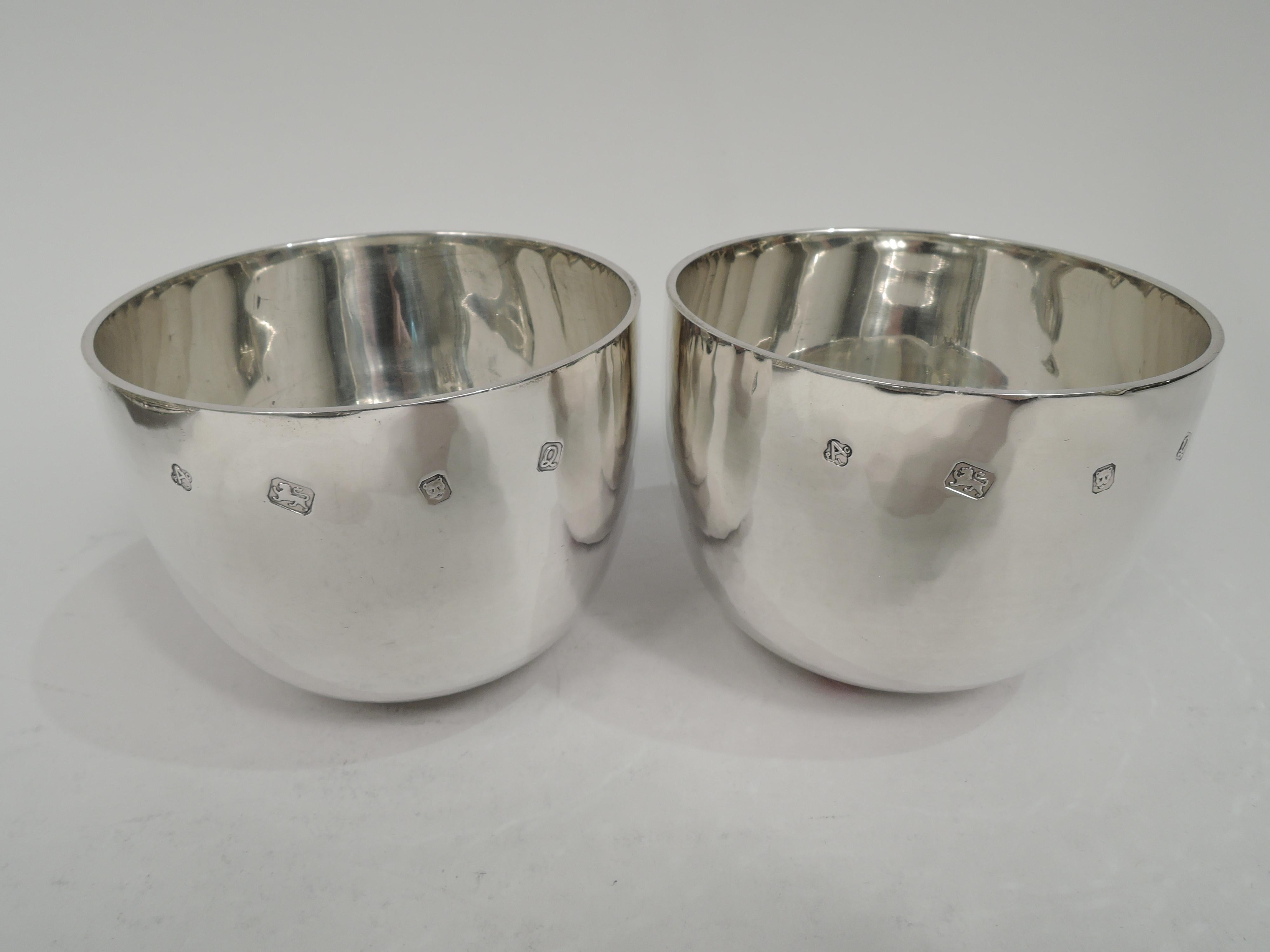 Pair of Elizabeth II sterling silver Jefferson cups. Made by Asprey in London in 1990. Each: Traditional form with straight sides and curved bottom. Easy grip with a gentle, soothing rock. Hand hammered with nice shimmer. Perfect for a twosome