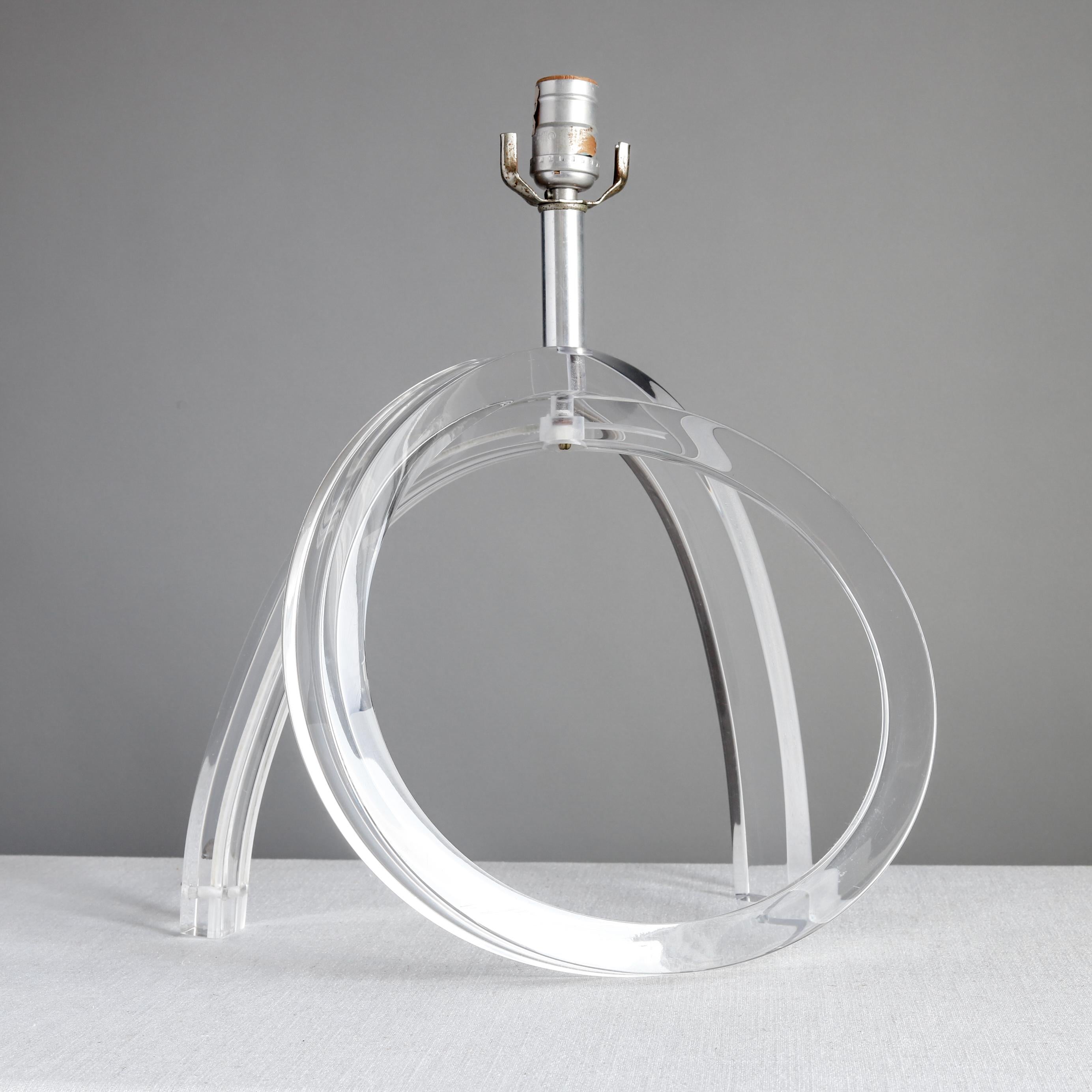 Pair of clear acrylic table lamps by Astrolite Products of Los Angeles, California. Astrolite was a term trademarked by company founder Herb Ritts, Sr., the father of the fashion photographer Herb Ritts, Jr. The cord runs down a groove in the back