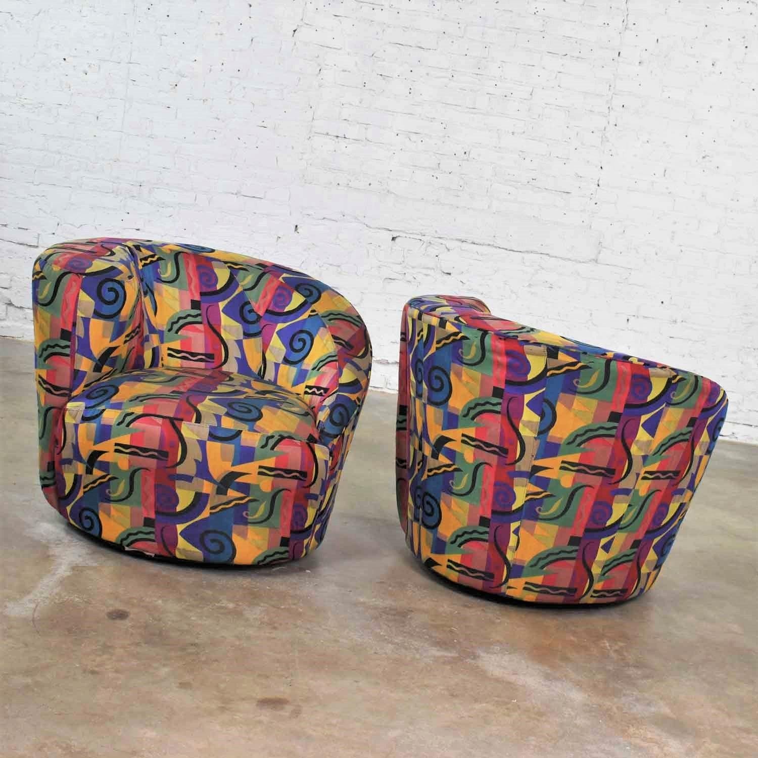 Handsome pair of asymmetric swivel chairs in the style of the Nautilus chair. But this pair is made by Sam Moore Furniture a La-Z-Boy company. They are in wonderful vintage condition and have been professionally cleaned. However, there are some