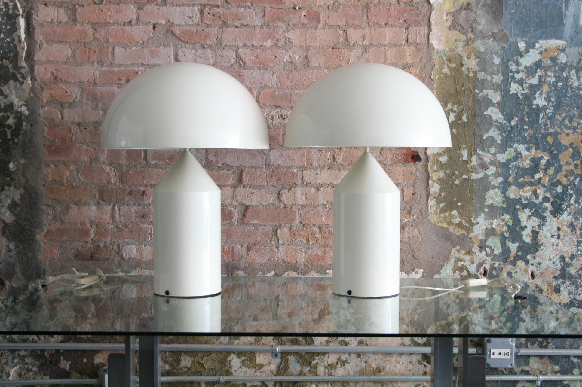 The Atollo table lamp is a strong portrayal of modern design, featuring a bold dome shade on top of a pointed cylinder. The robust and simple nature of the design is absolutely why it has become iconic since its launch in 1977.
