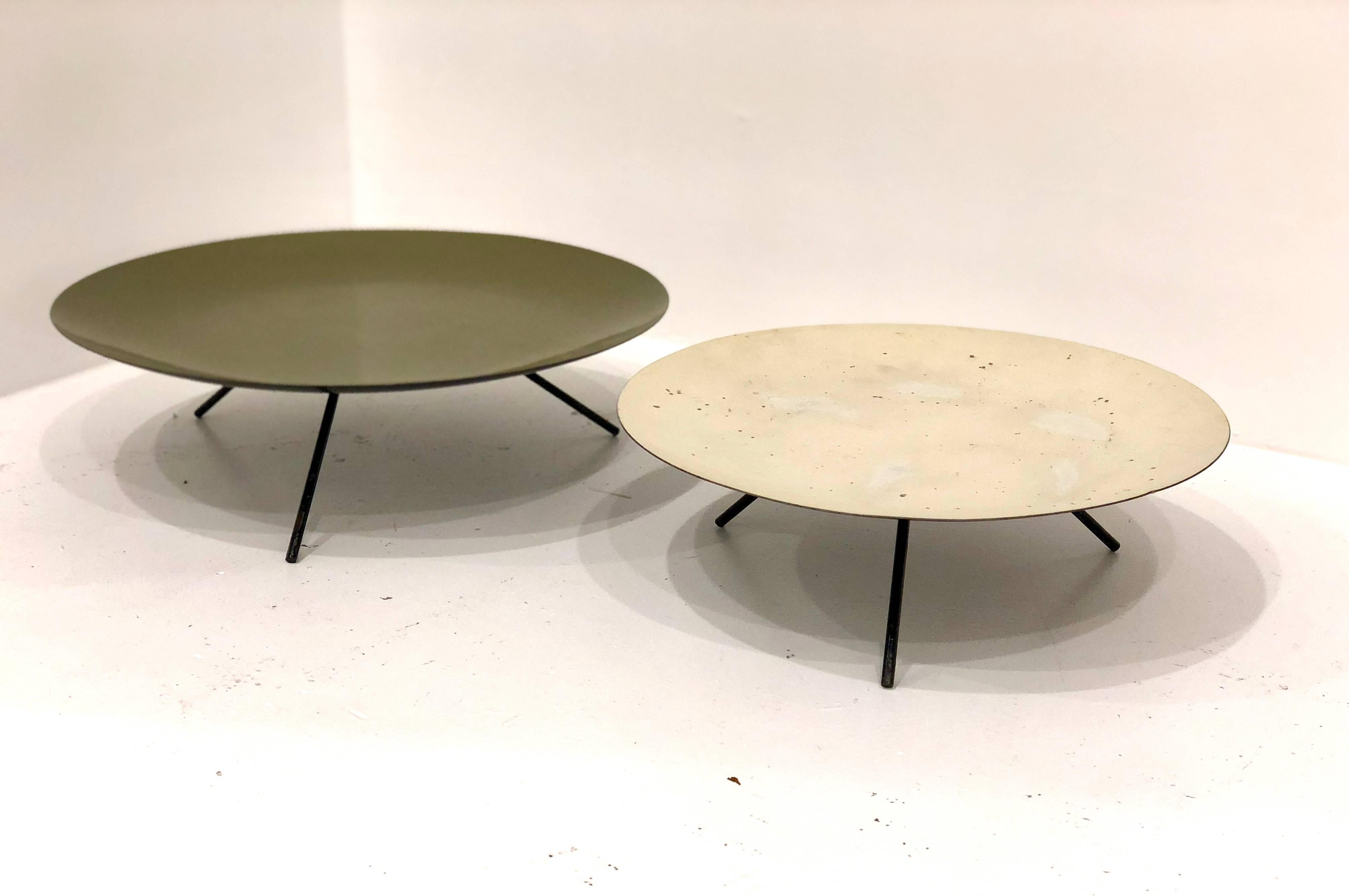 Unique and rare pair of triple legged, serving trays by Trend of California, circa 1950s enameled green and cream tops combo on a mate black bottom, and three mini legs welded two different heights and diameter sold in AS/IS condition rare pieces